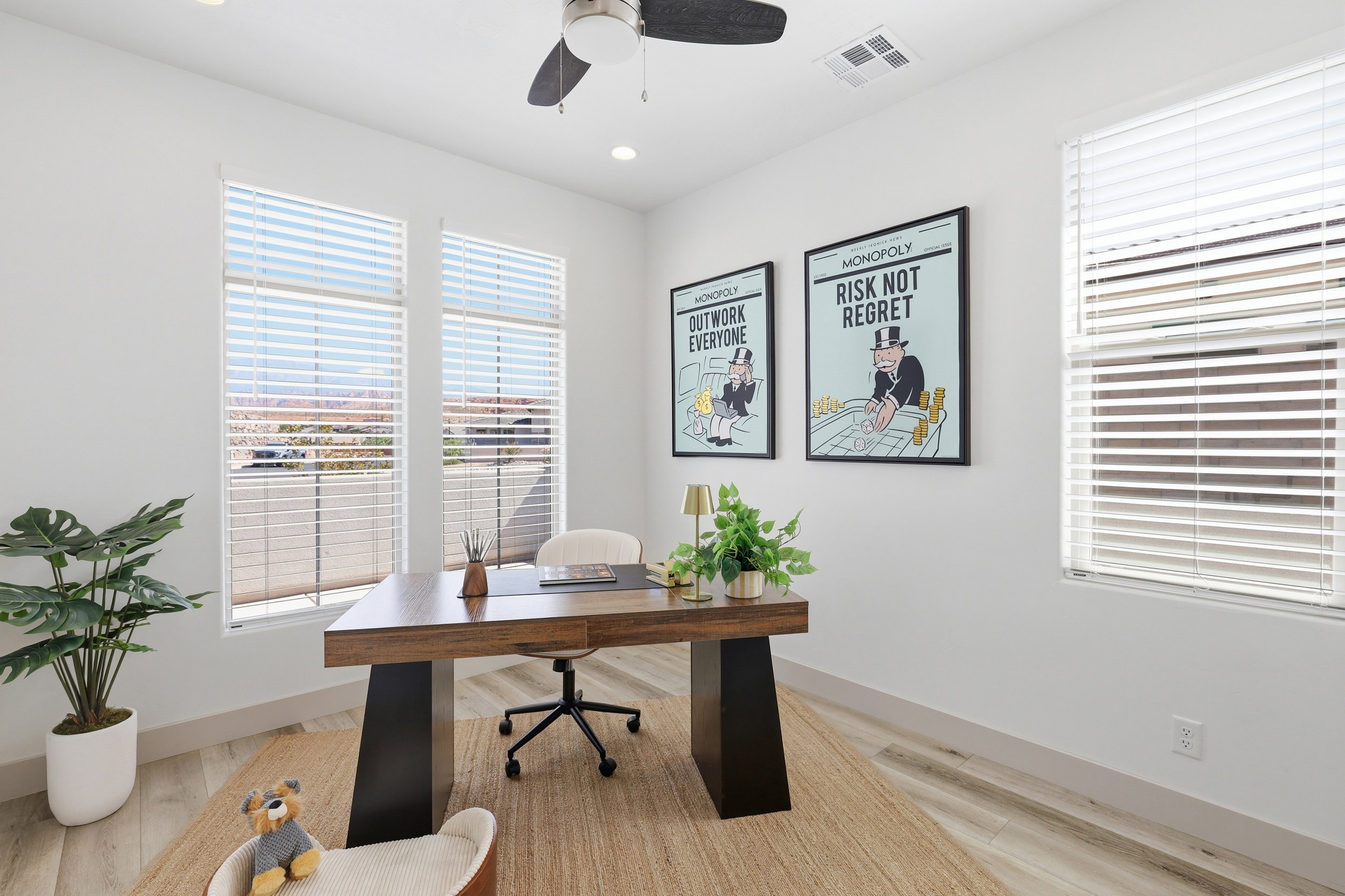 Bright room featuring two large windows with blinds, recessed lighting, a ceiling fan, and light wood-finish flooring