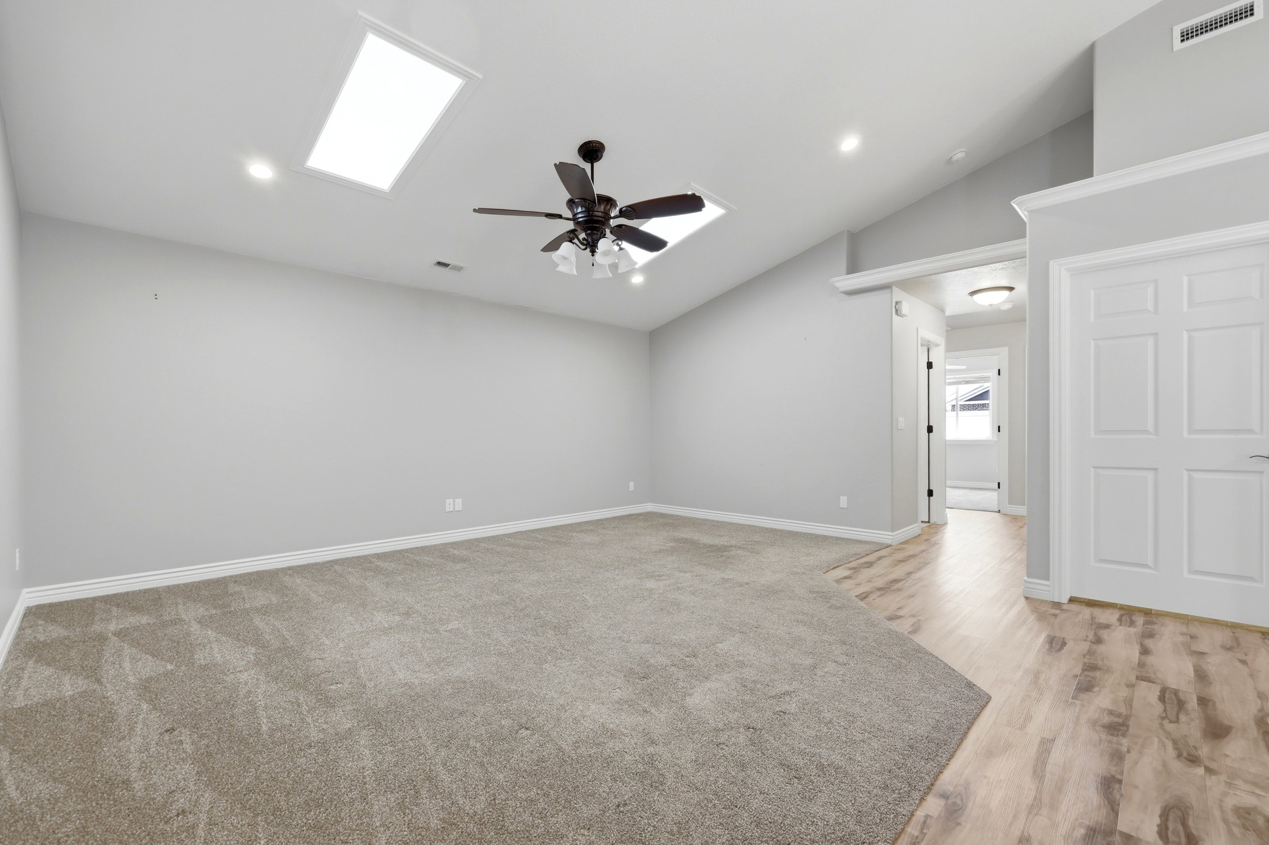 Vaulted ceilings with skylights and recessed lighting in master bdrm