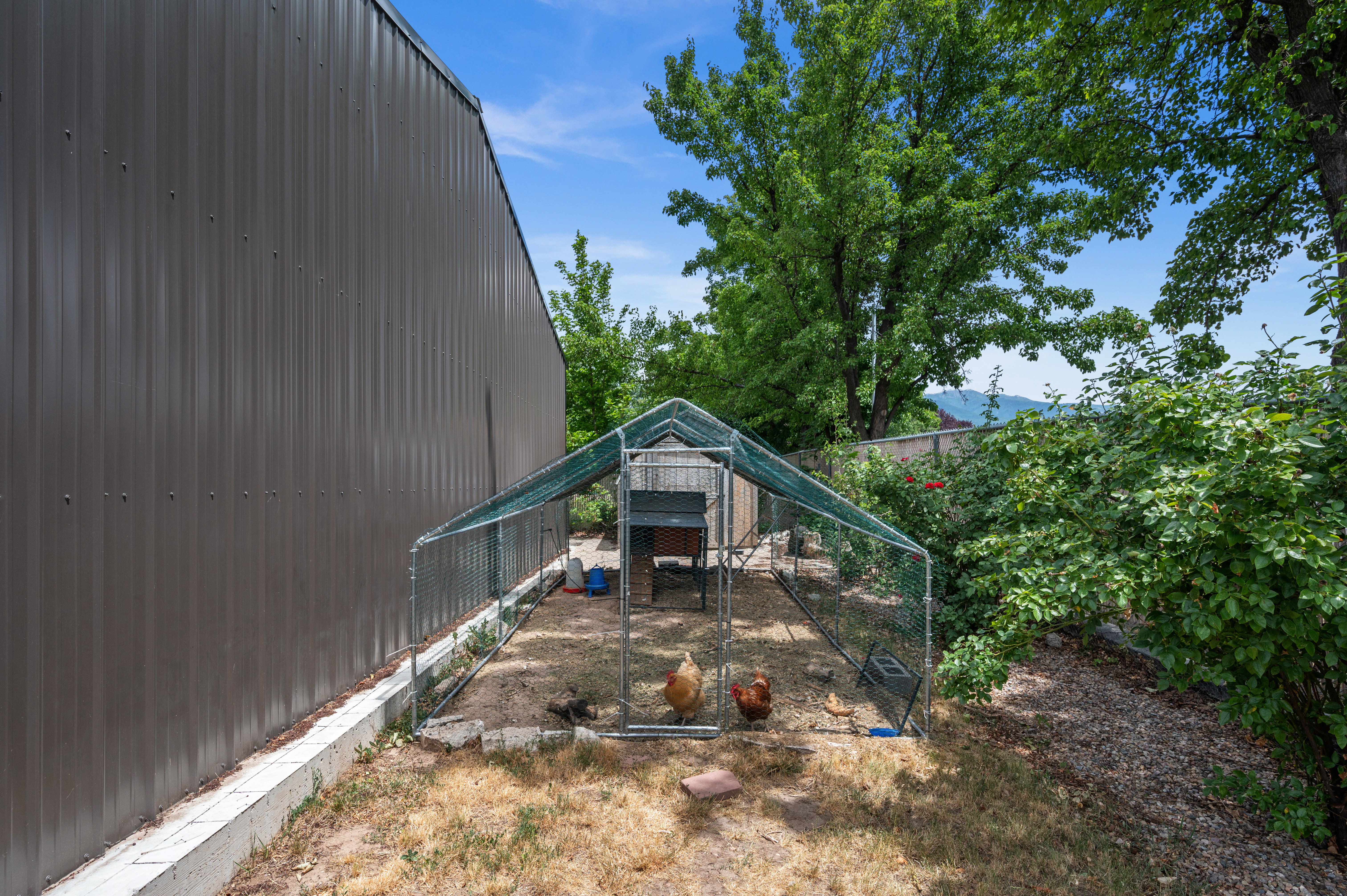 Corrugated metal-clad building with a concrete foundation