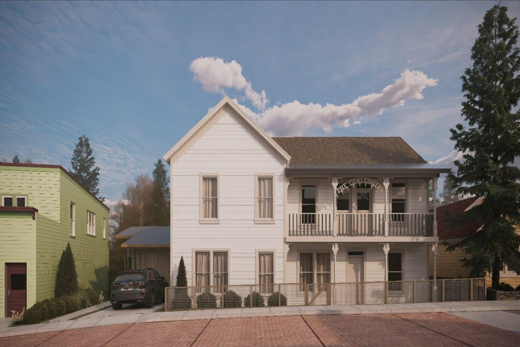 Two-story white residence featuring a decorative second-story balcony with spindle railings