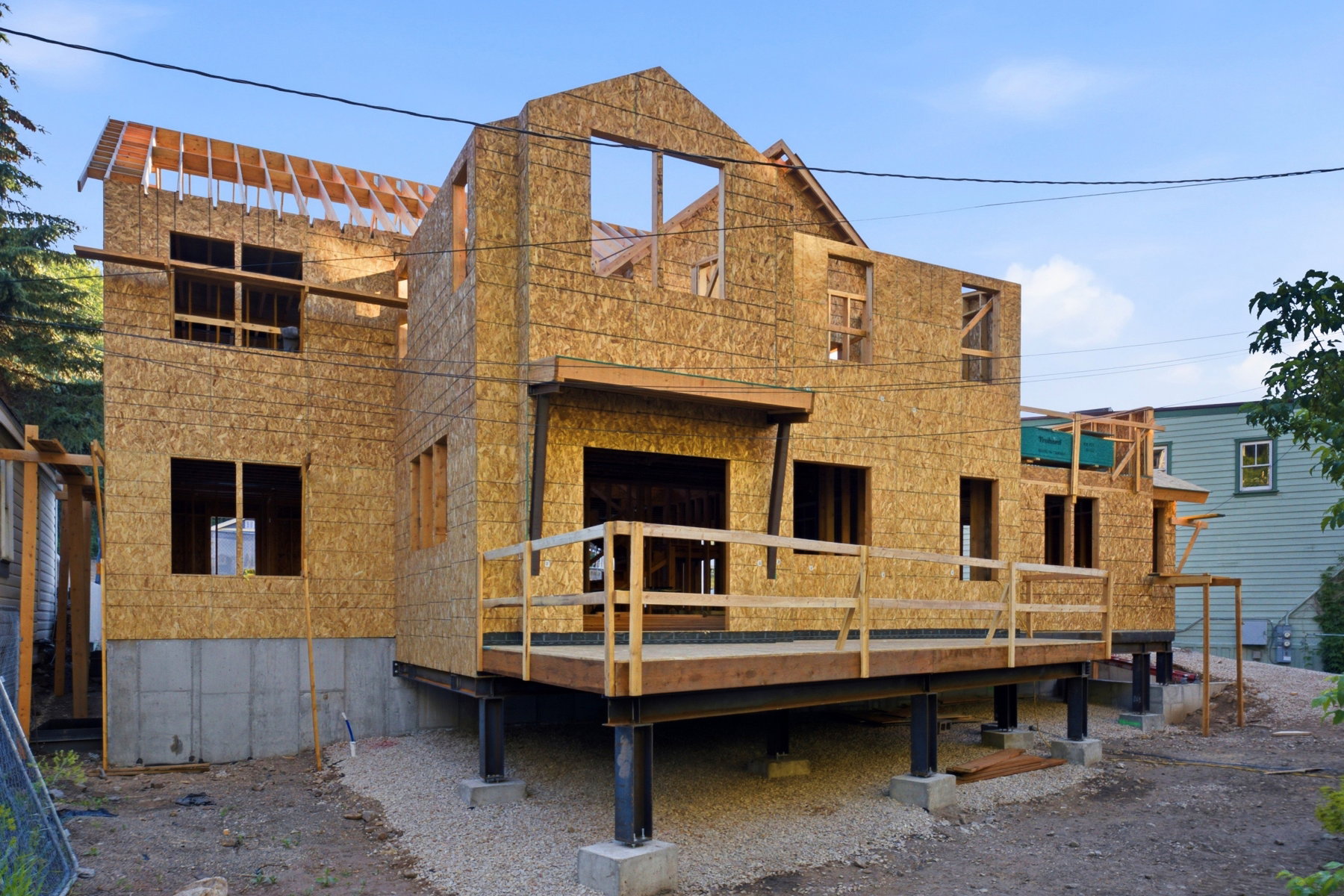 New construction framing with sheathing and exposed roof trusses