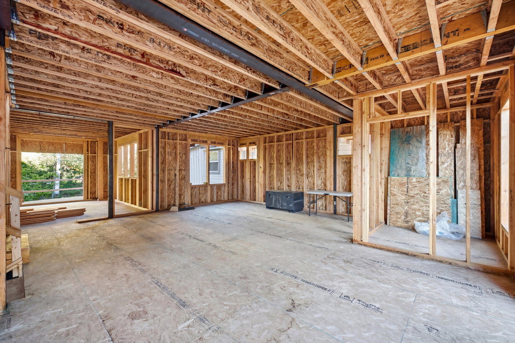 Exposed structural framing showcasing engineered wood joists and subflooring
