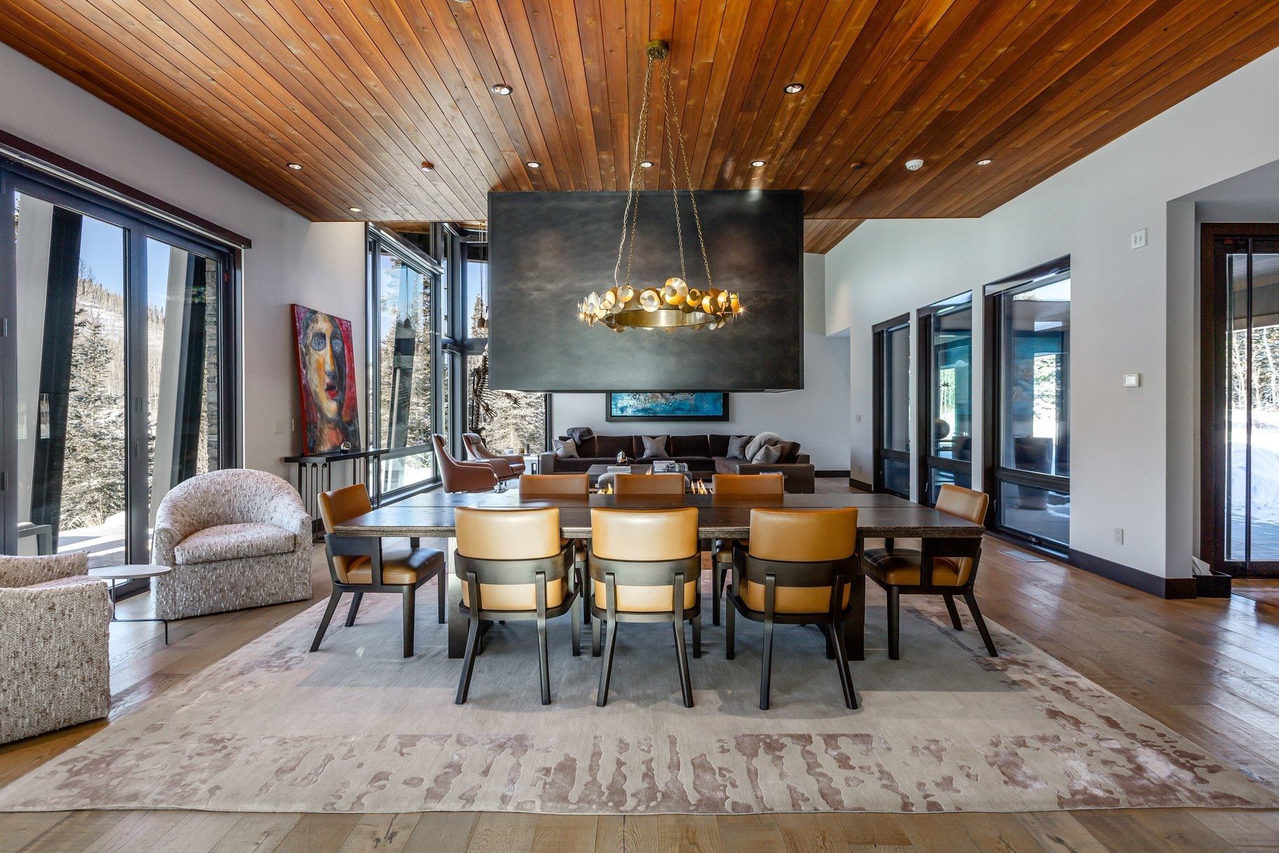 Spacious dining area featuring a wood-finish ceiling, large format windows, and hardwood flooring