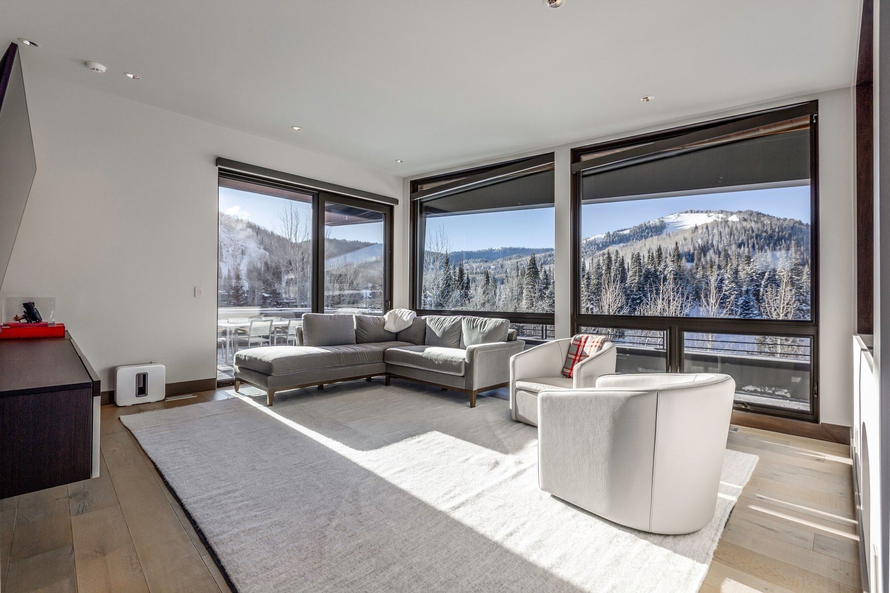 Expansive window wall with mountain scenery