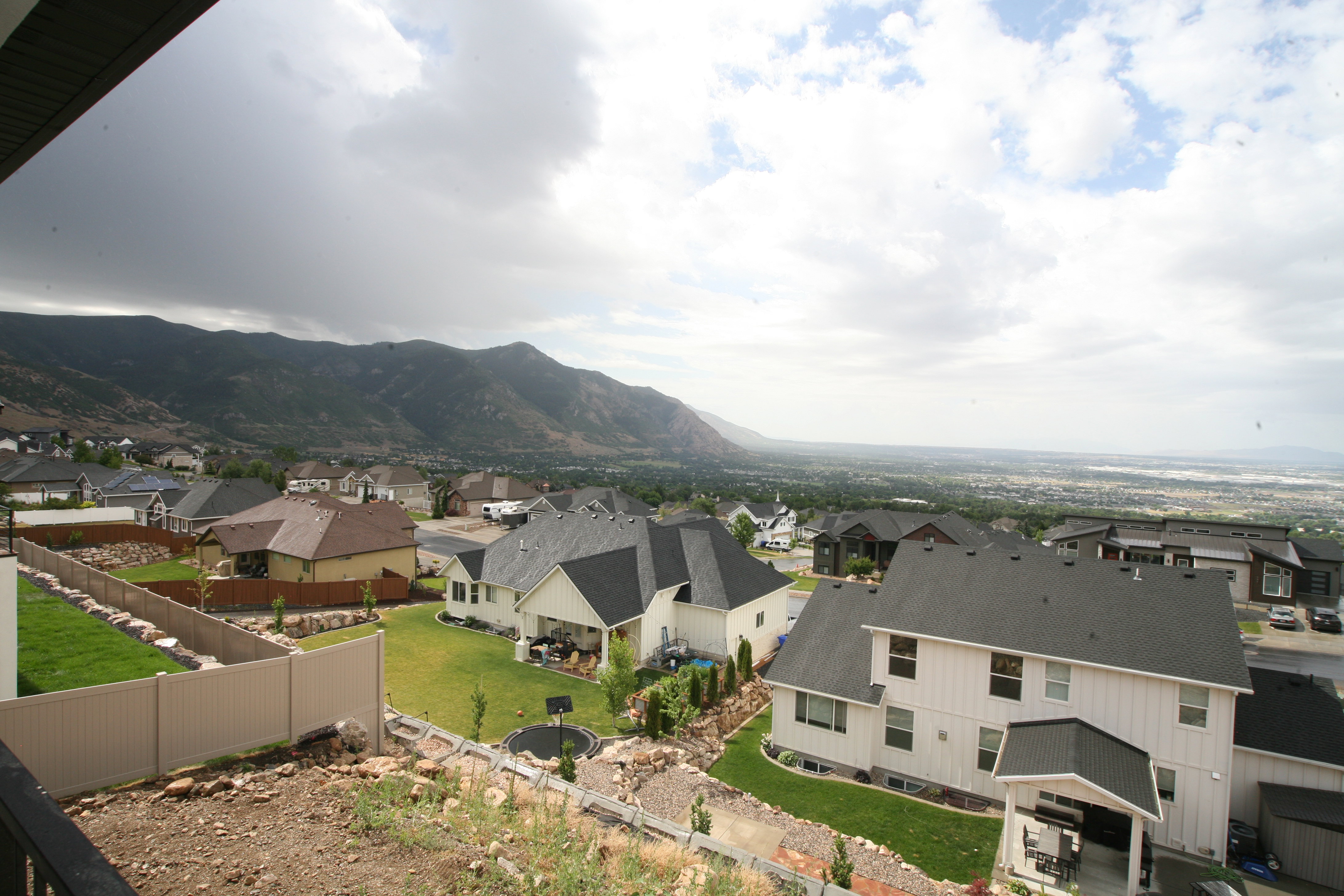 Expansive mountain scenery with distant cityscapes