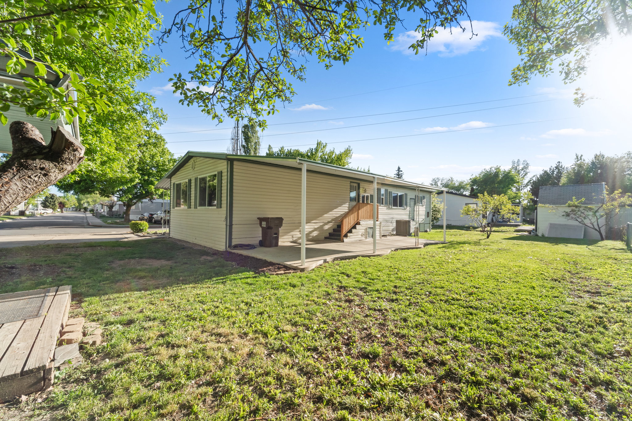 Expansive green lawn with mature trees