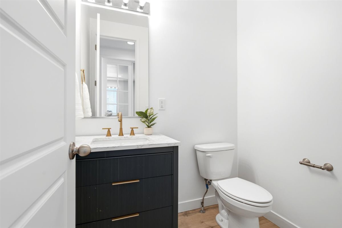 1/2 bath in mudroom area, easy access from garage and rear entrance