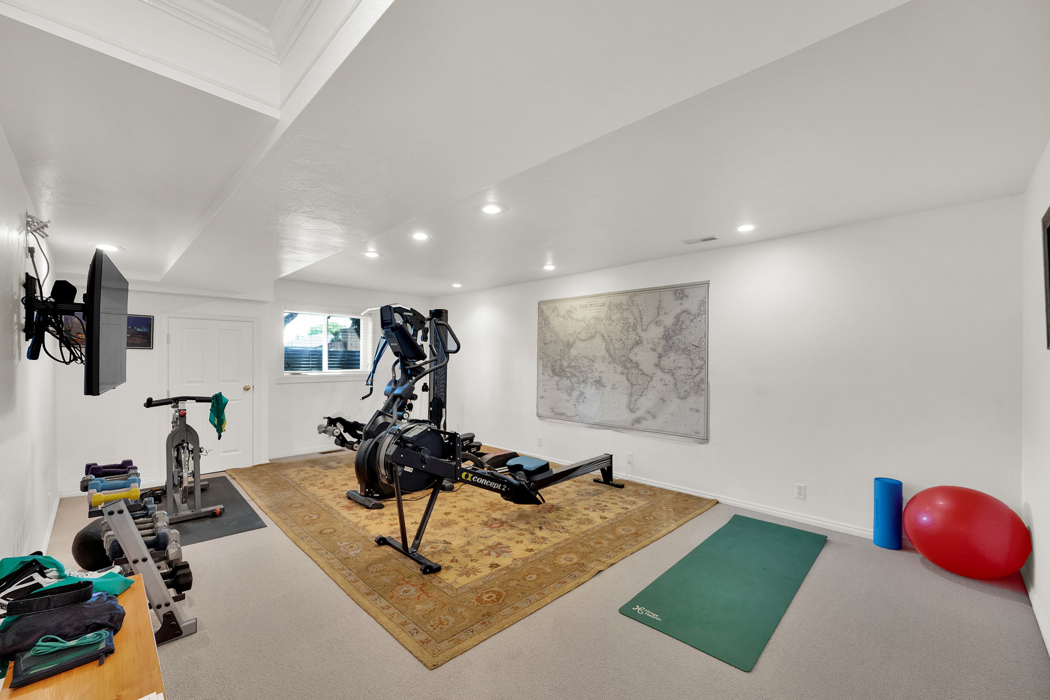 Spacious bonus/exercise room featuring recessed lighting