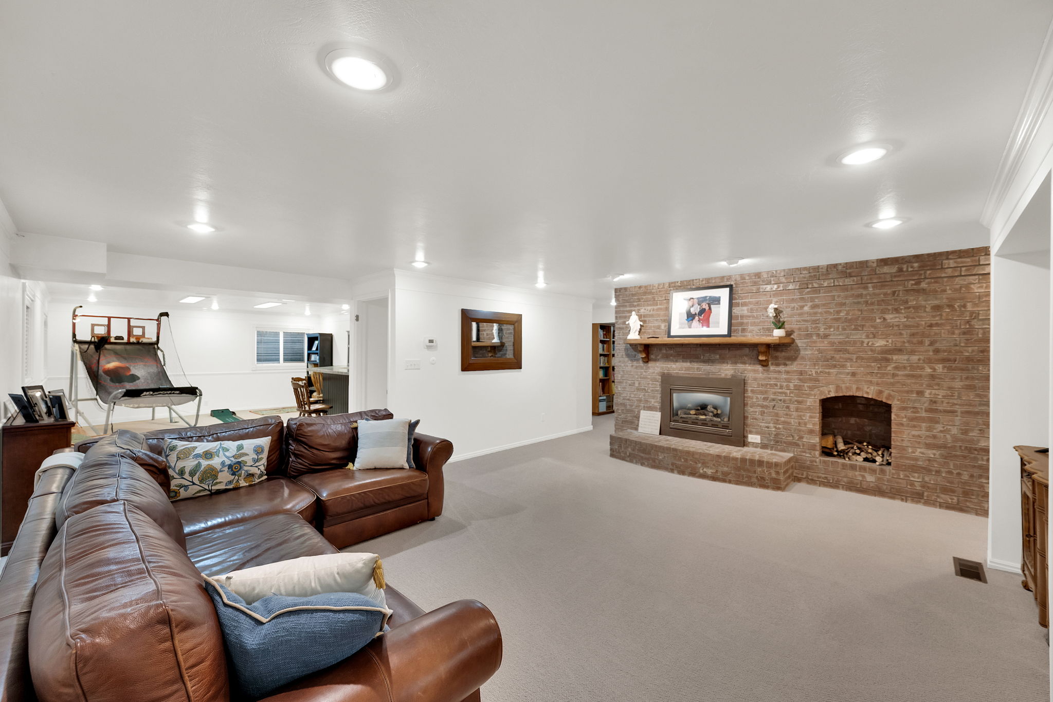 Basement family room with cozy fireplace