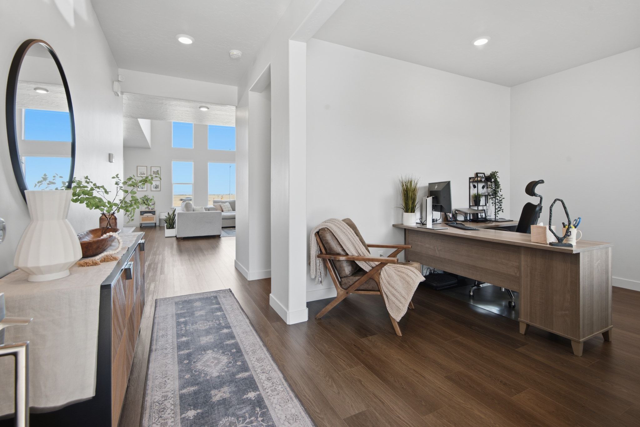 Dedicated office space featuring wood-finish flooring and ample natural light