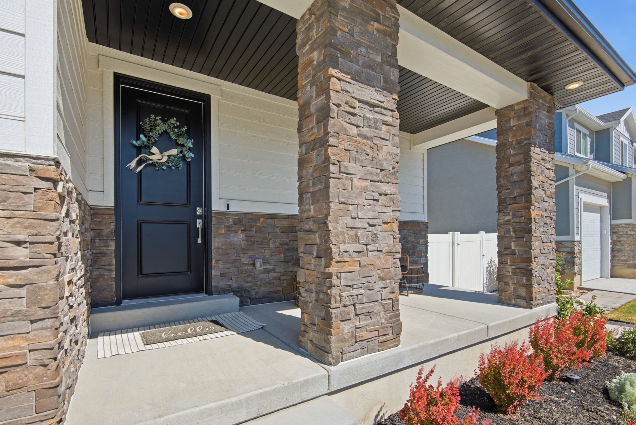 Stone veneer accenting the front facade and porch columns