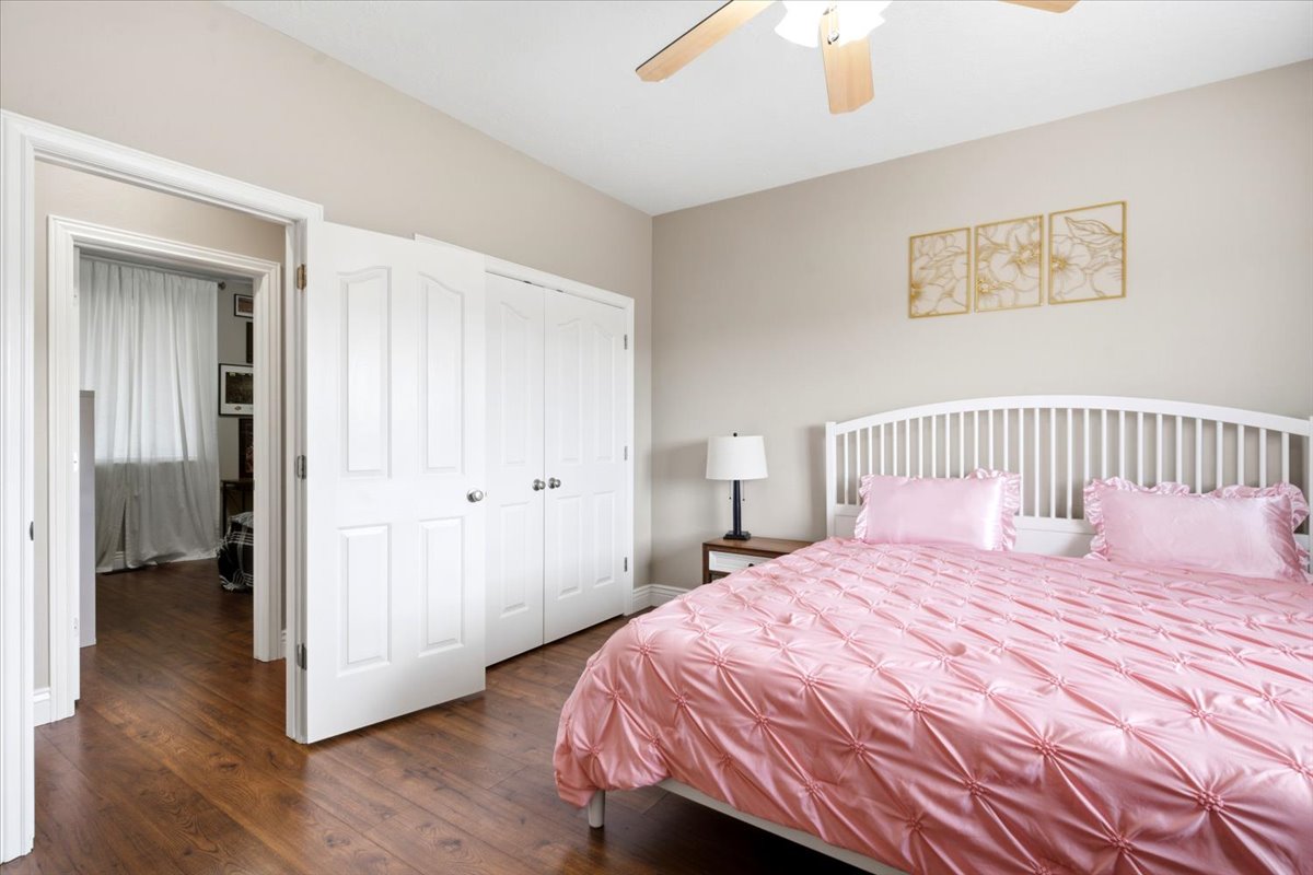 Warm wood-finish flooring complements neutral wall tones