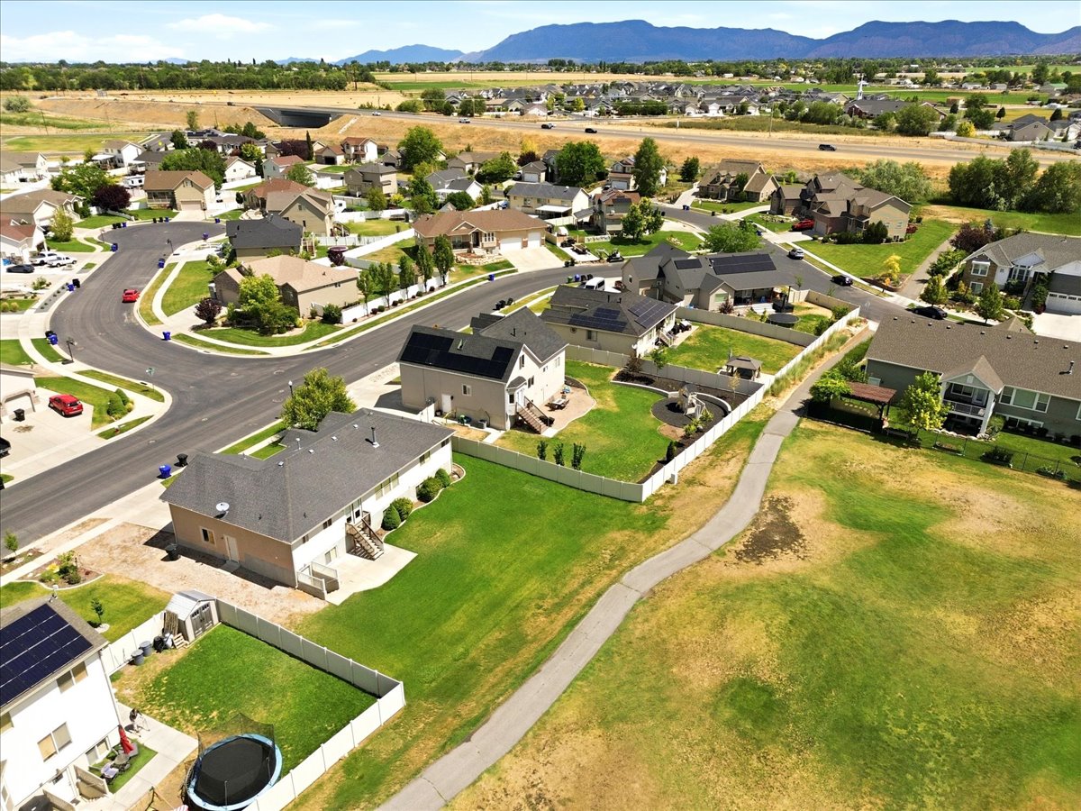 Residential neighborhood featuring single-family homes with pitched roofs and manicured lawns