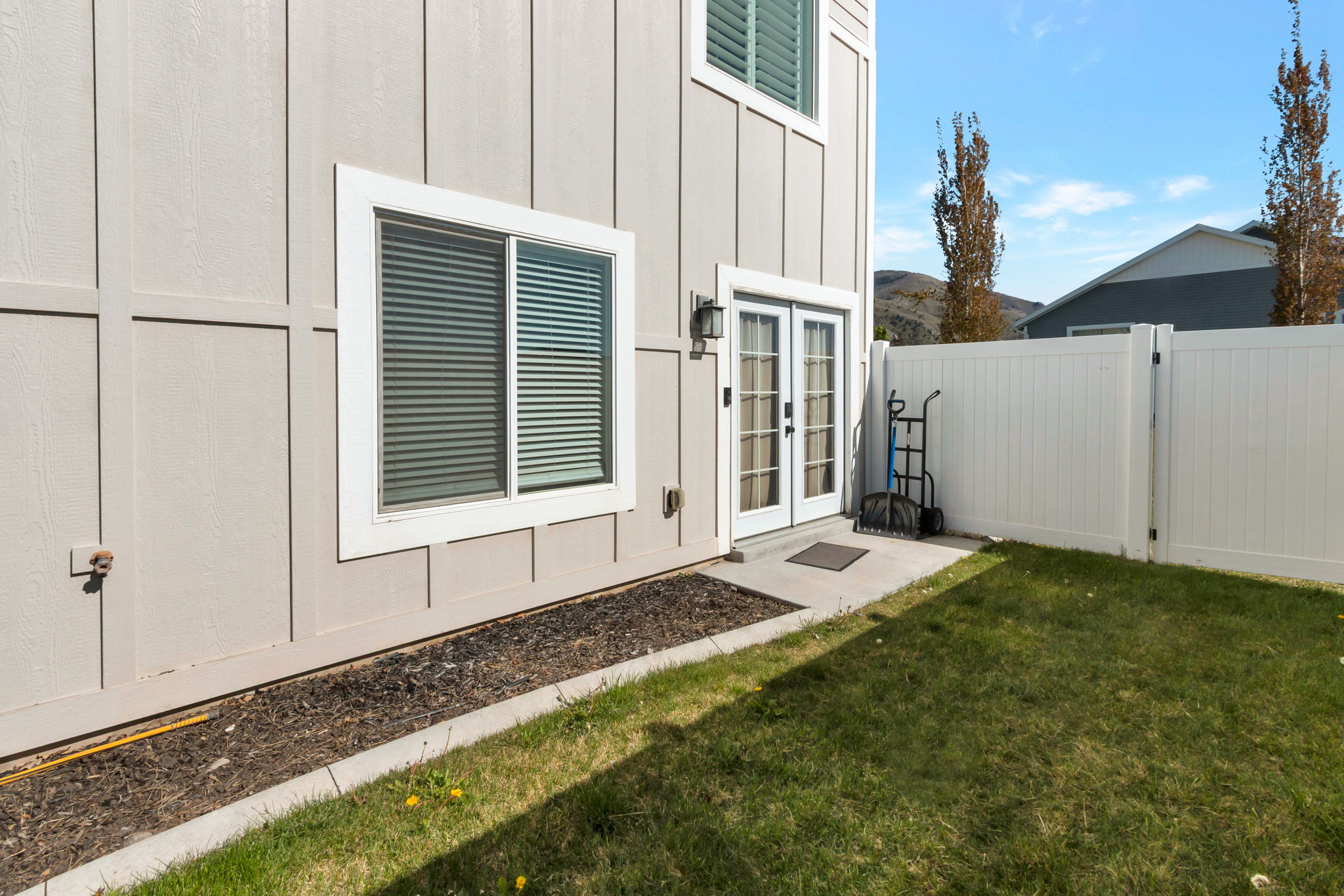 Private outdoor space featuring a well-maintained lawn and perimeter fencing
