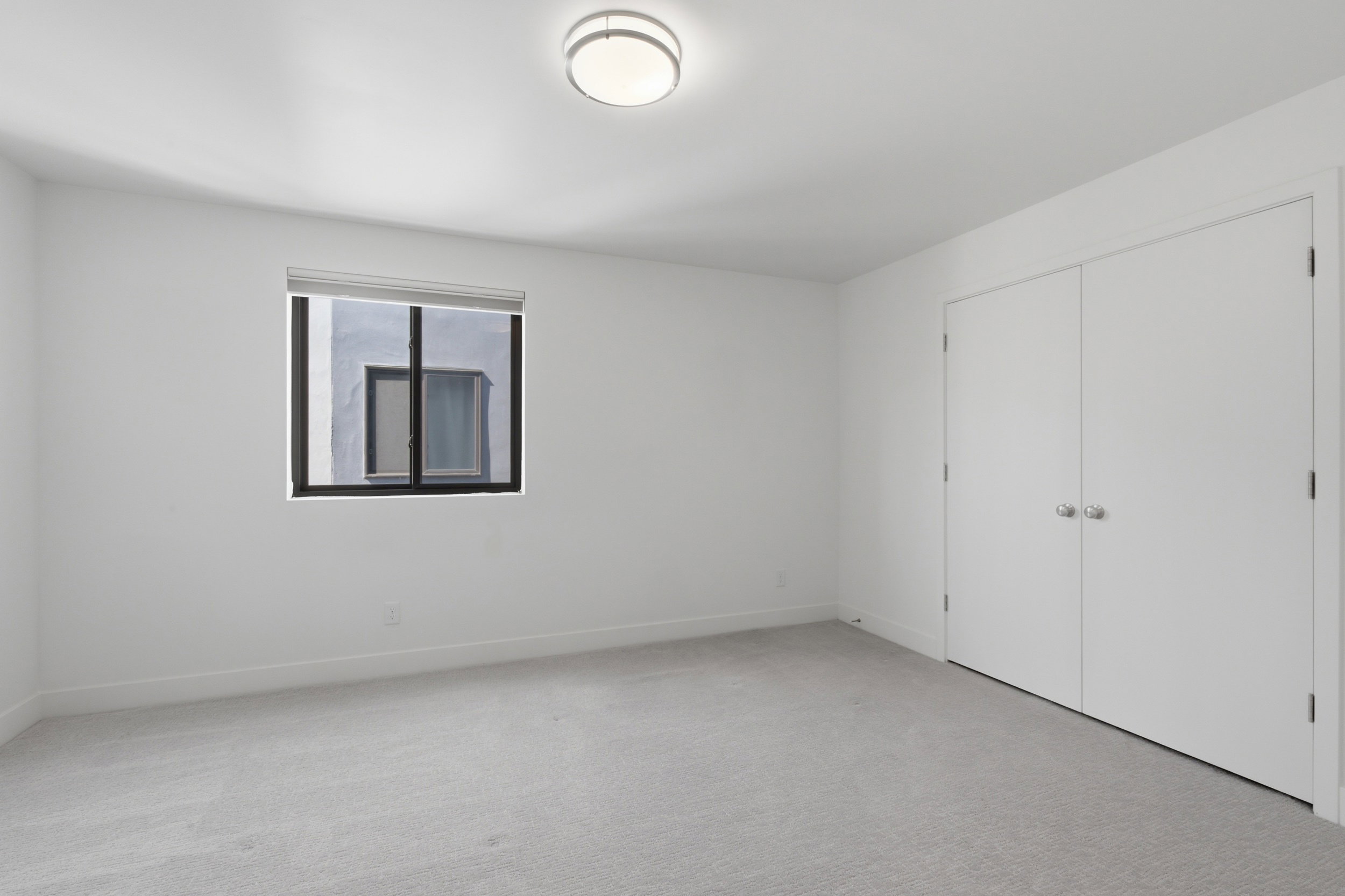 Second ensuite bedroom on upper level with walk-in closet