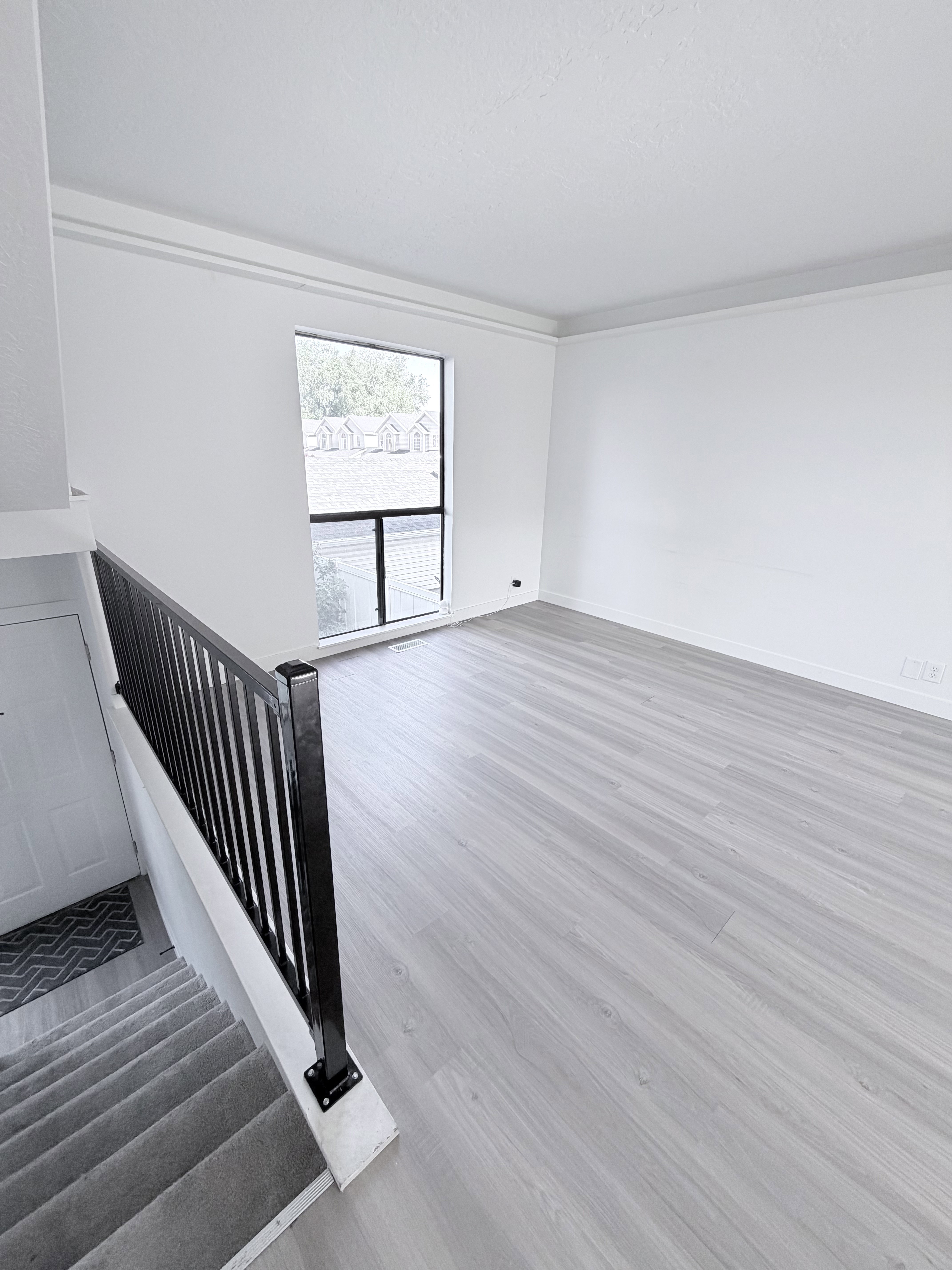 Open concept living area featuring light wood-finish flooring