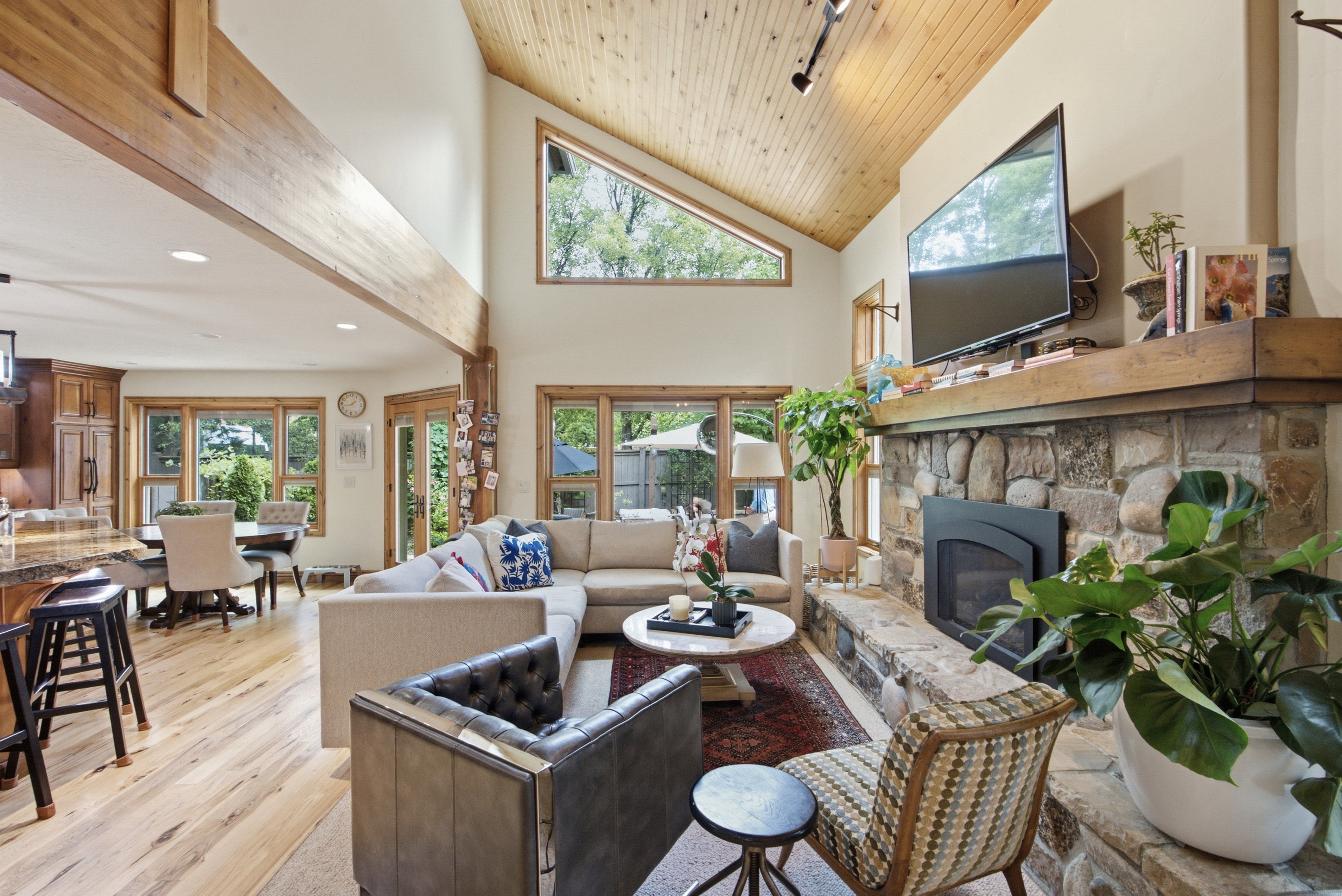 Vaulted wood-paneled ceiling with exposed wood beams