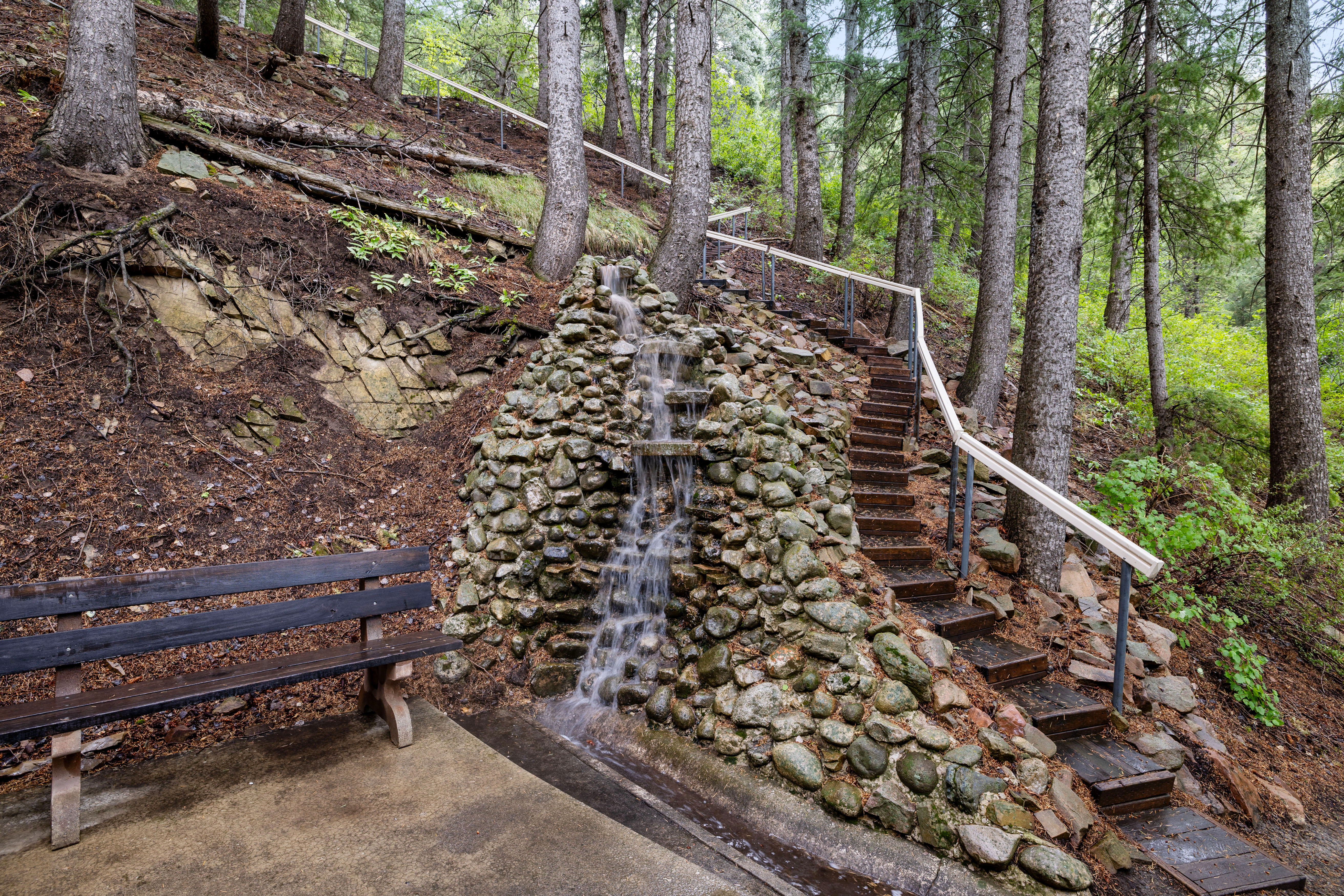 Stone waterfall with stairs that lead to Lovers Ln.
