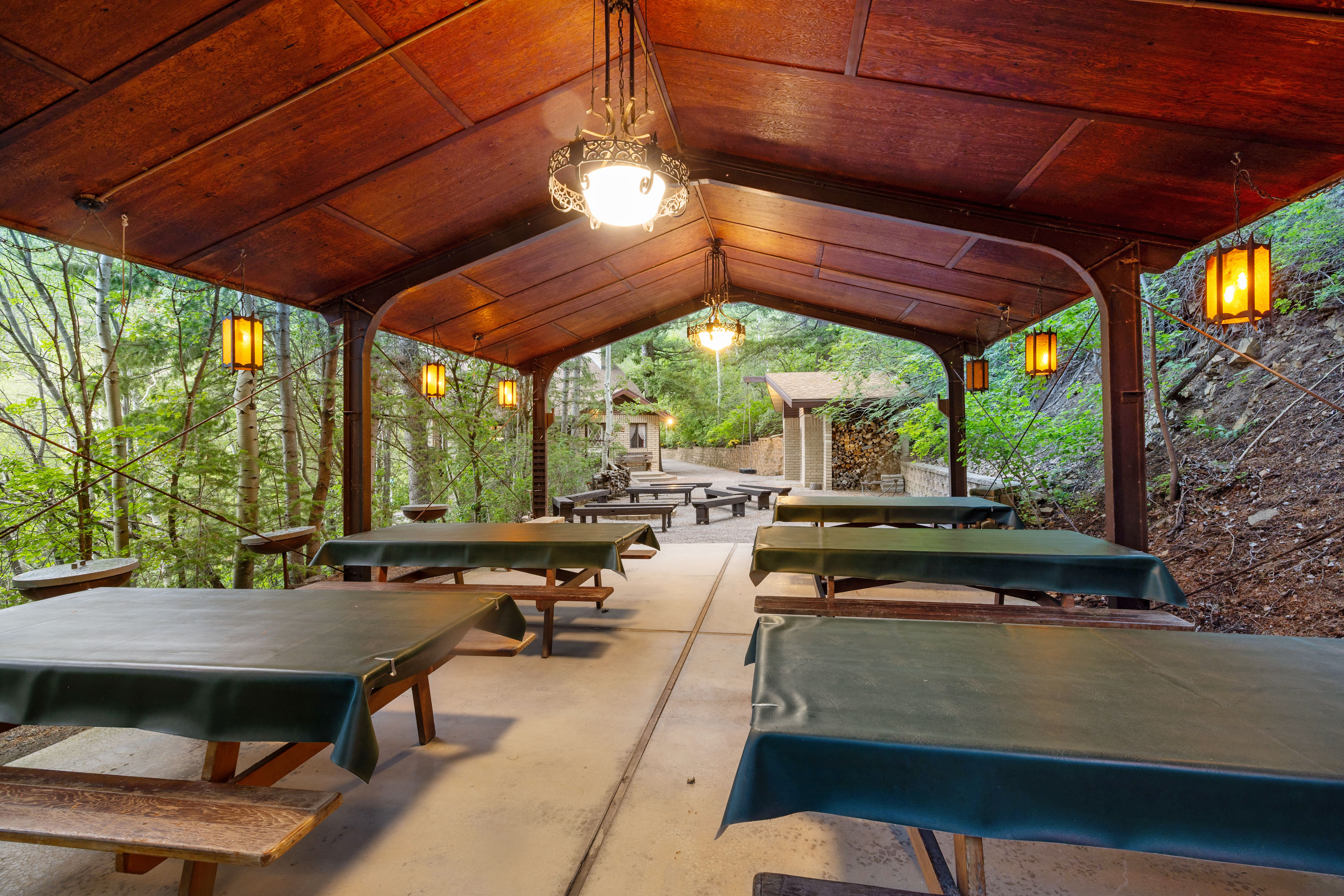 Pavilion featuring a wood-paneled ceiling and decorative pendant lighting