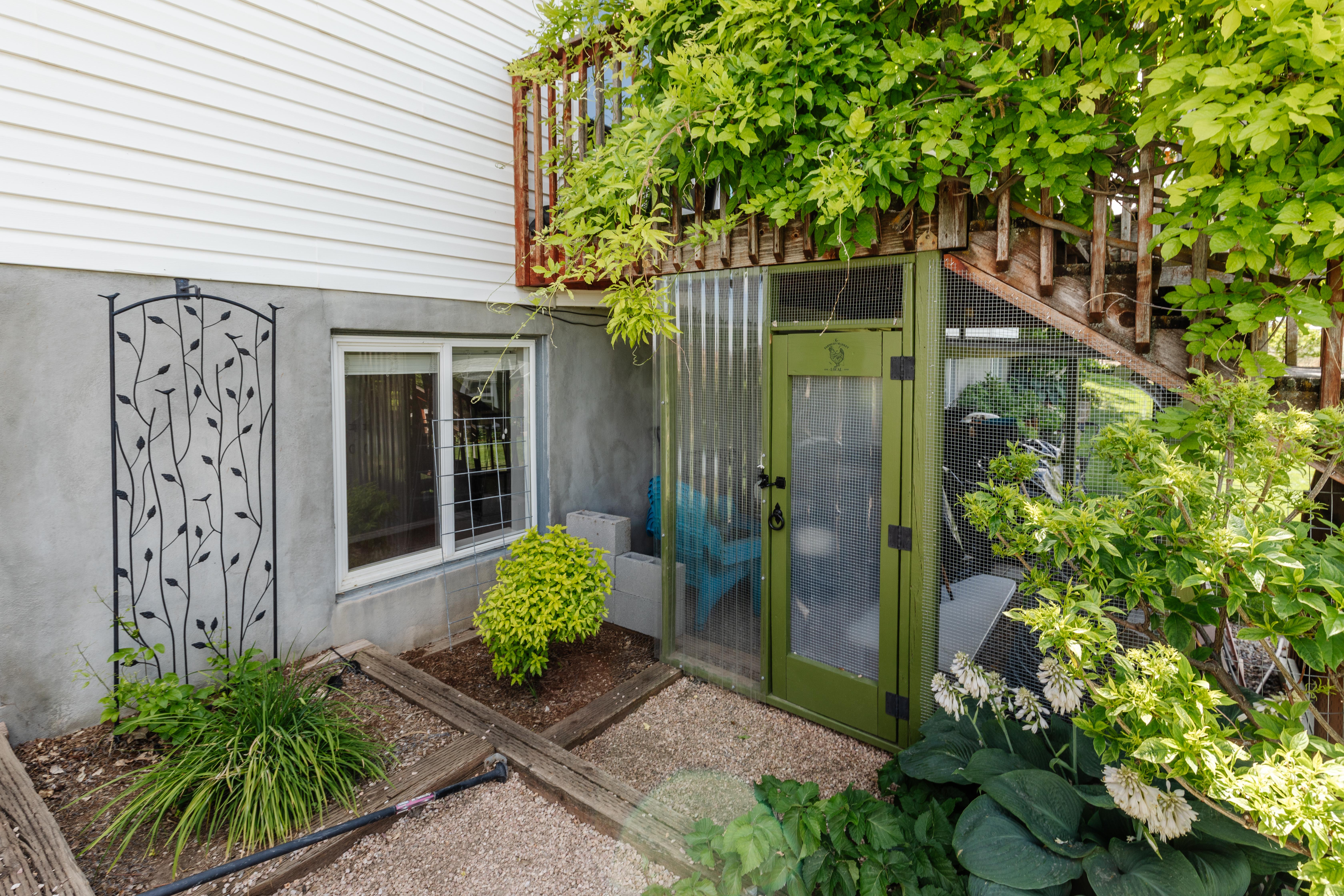 White vinyl siding exterior with a concrete foundation