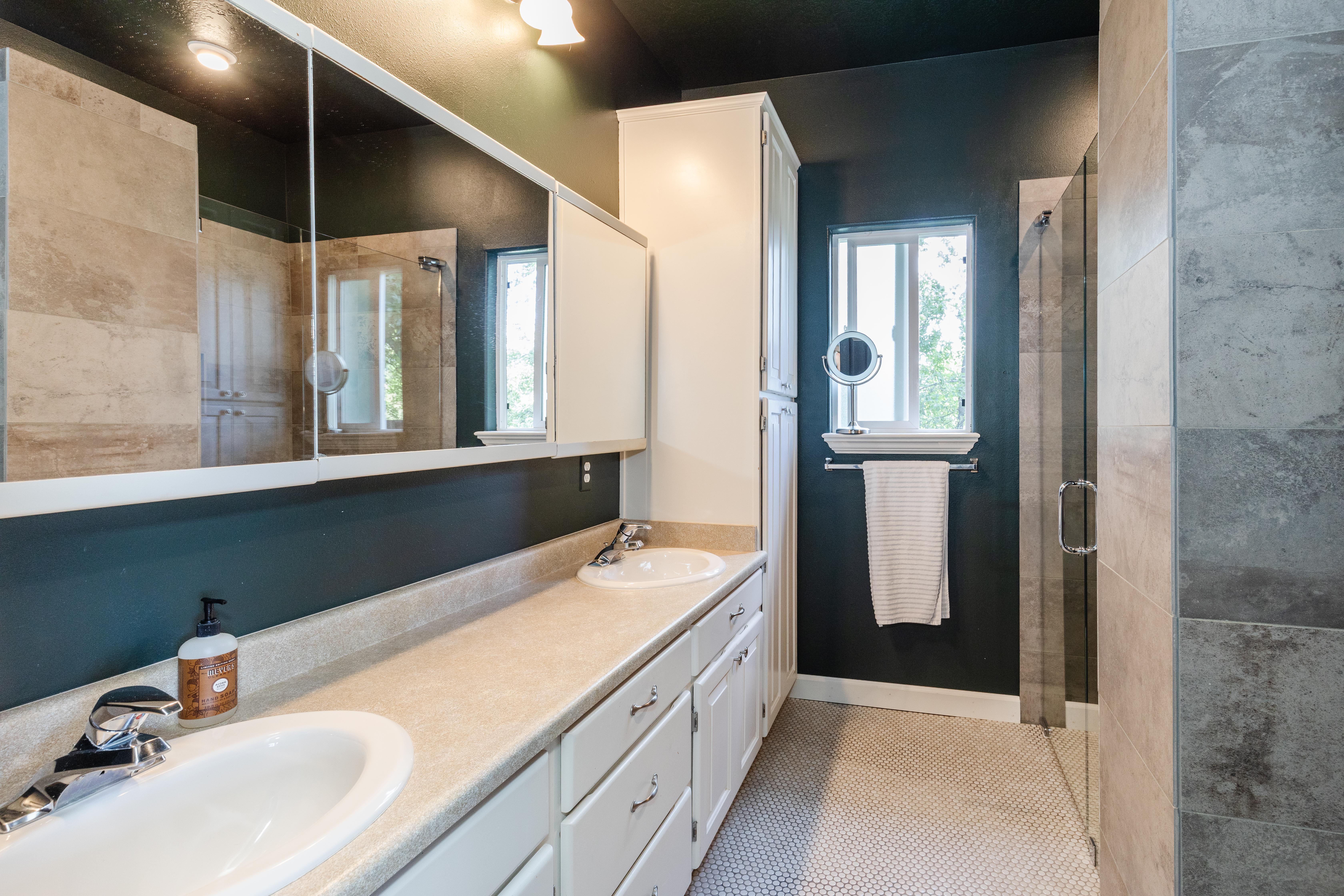 Dual vanity with integrated sinks and chrome fixtures