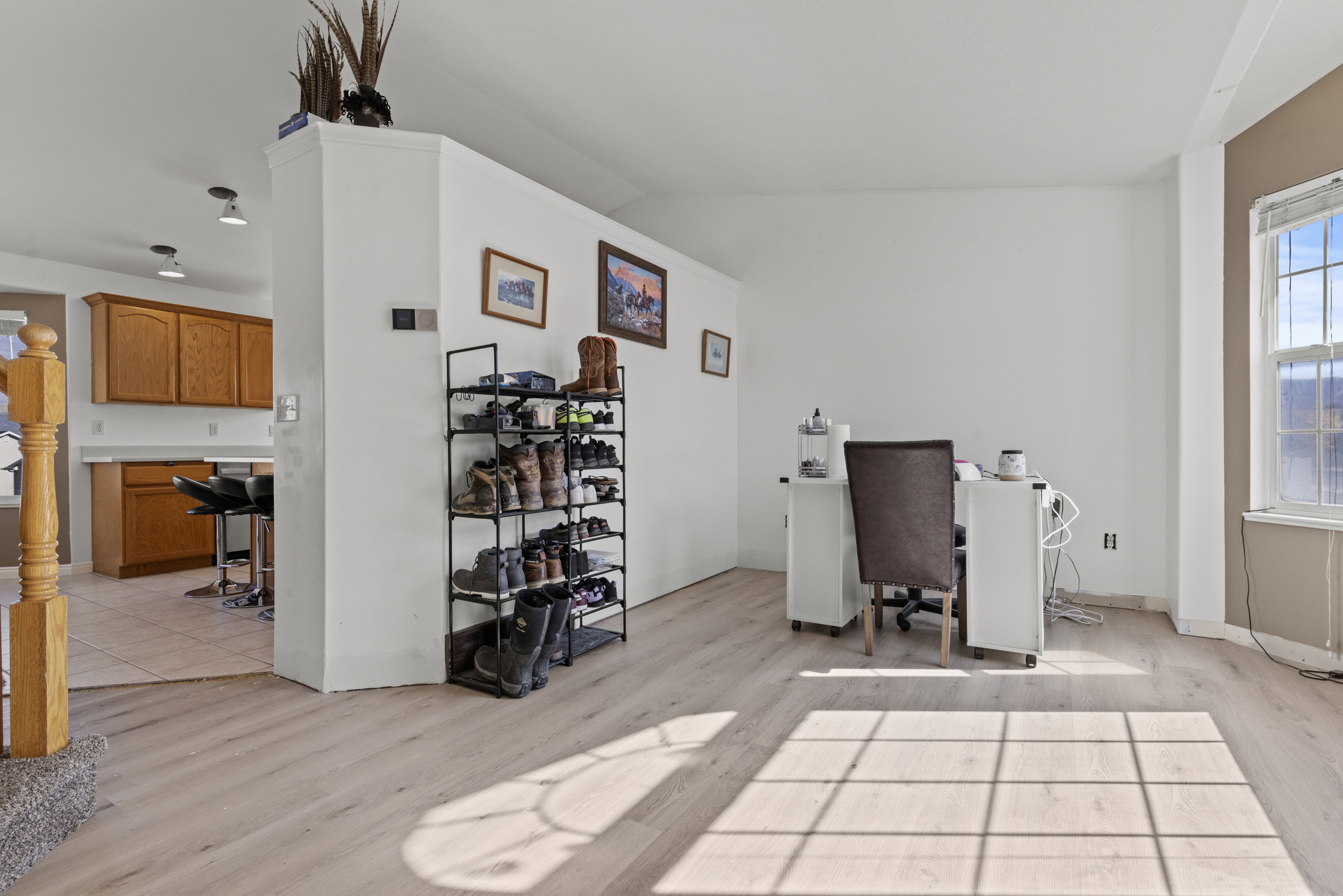 Light wood-finish flooring extending into the main living area