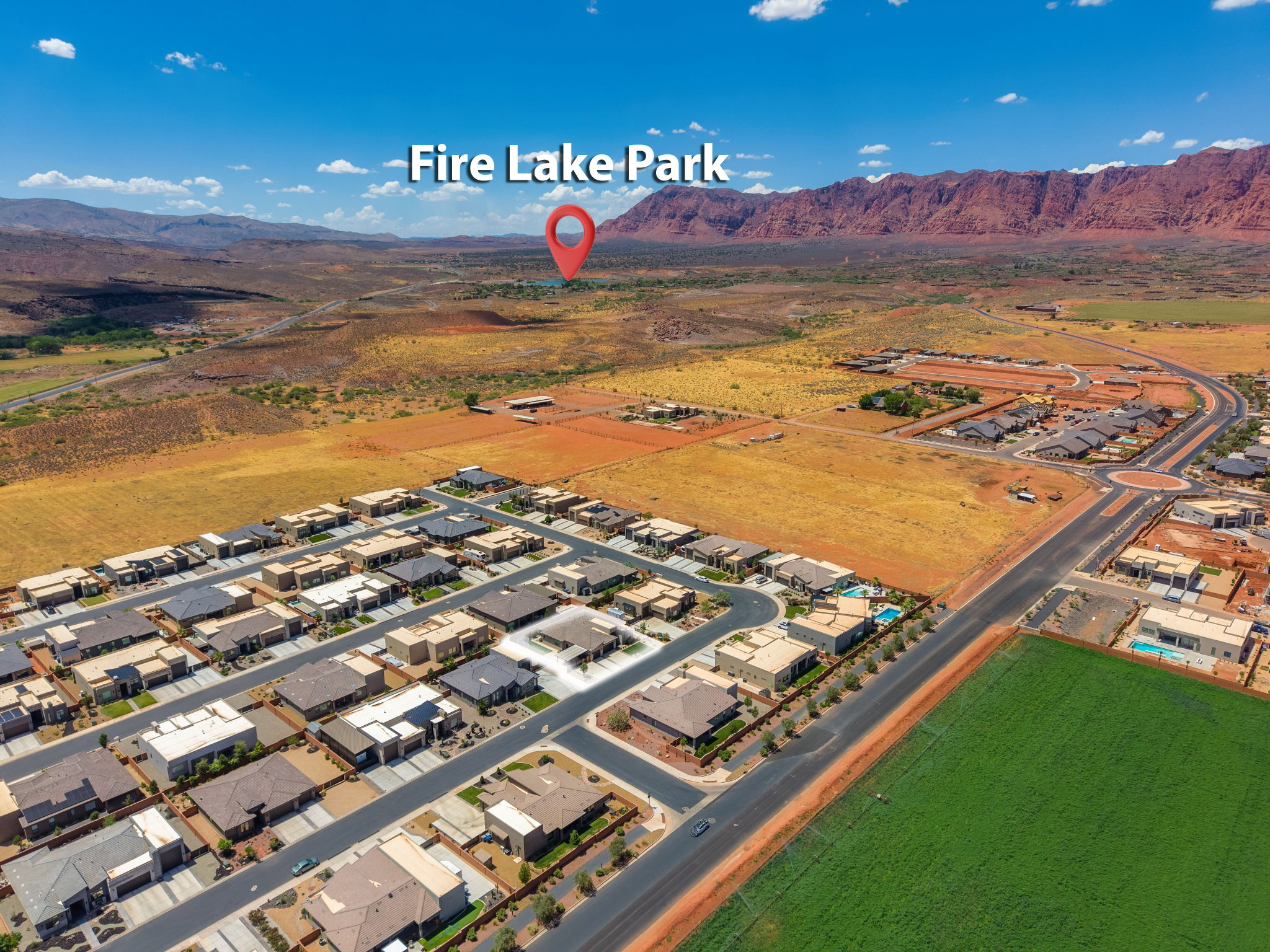 Aerial view of a residential community featuring a network of streets and a mix of single-story homes