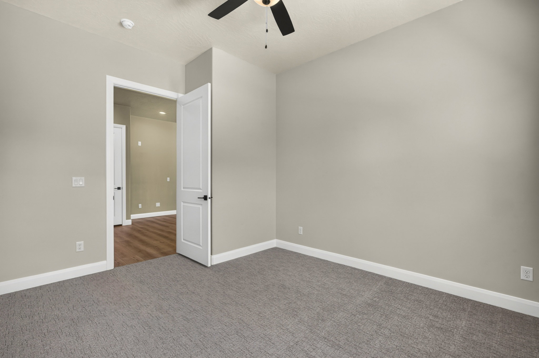 Room featuring plush gray carpeting and neutral wall paint