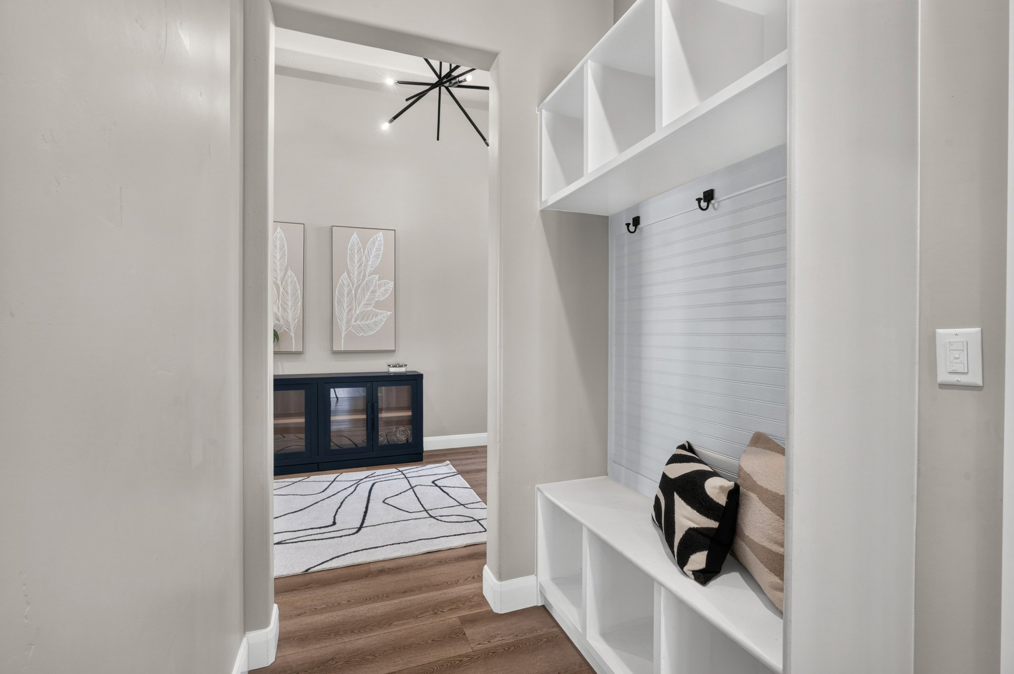 Integrated built-in bench with cubby storage and overhead shelving