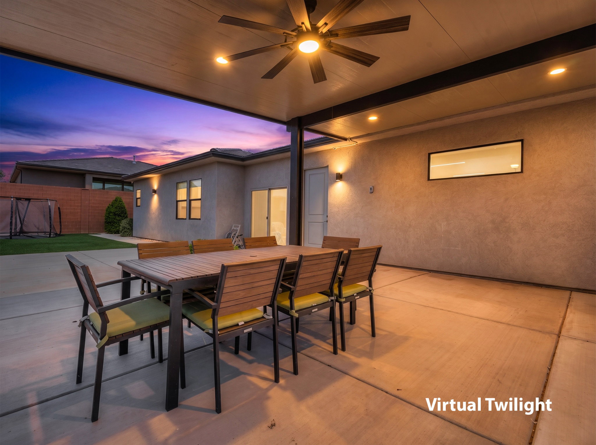 Covered patio featuring a ceiling fan, recessed lighting, and integrated wall sconces