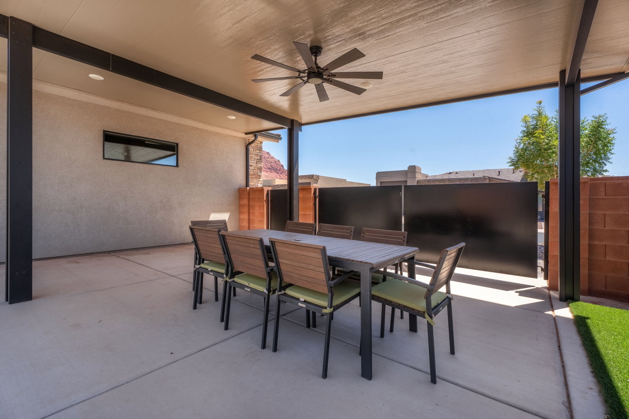 Covered patio with a ceiling fan, recessed lighting, and a stucco exterior wall
