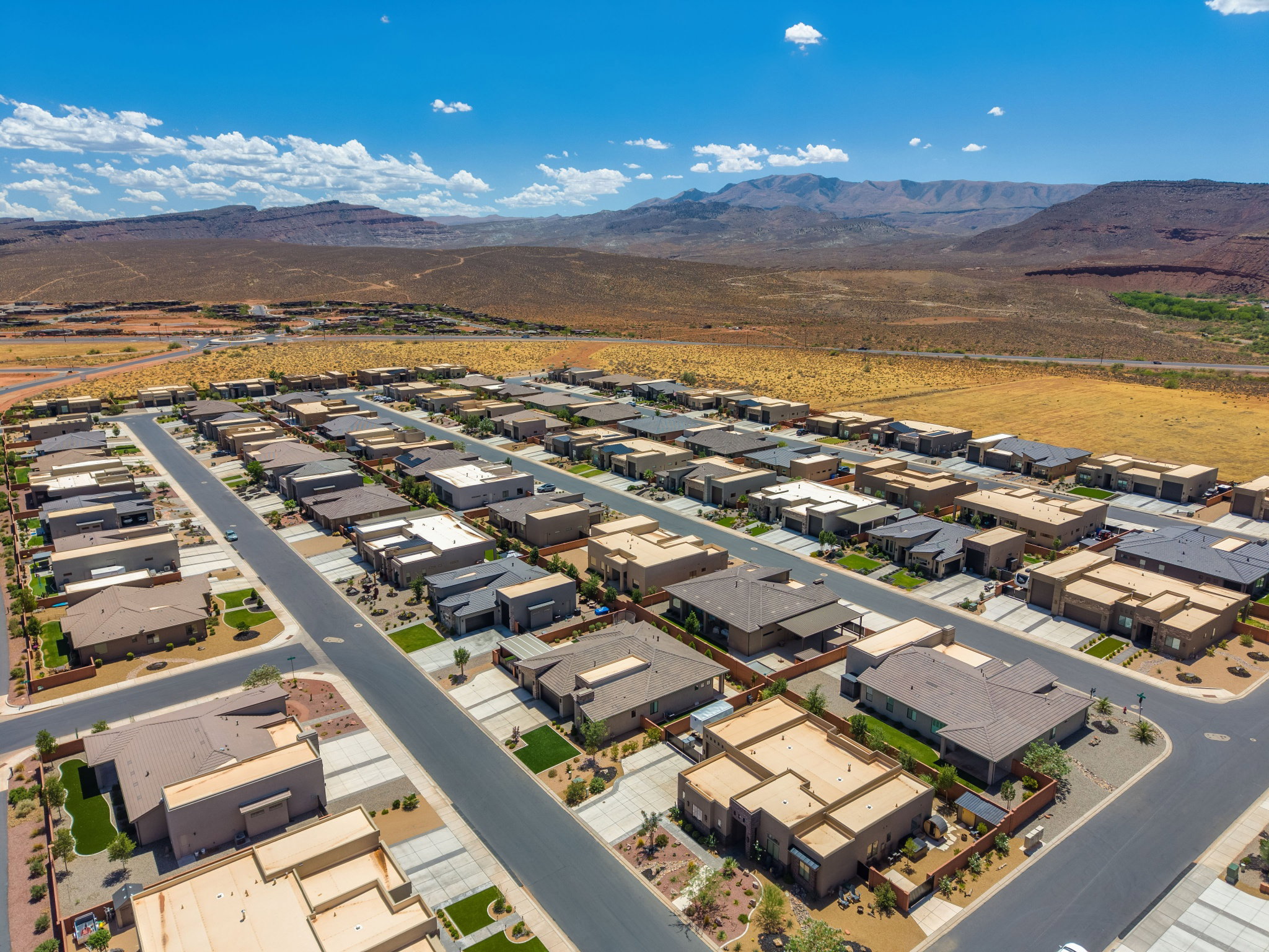 Expansive community with varied contemporary architectural styles and paved streets