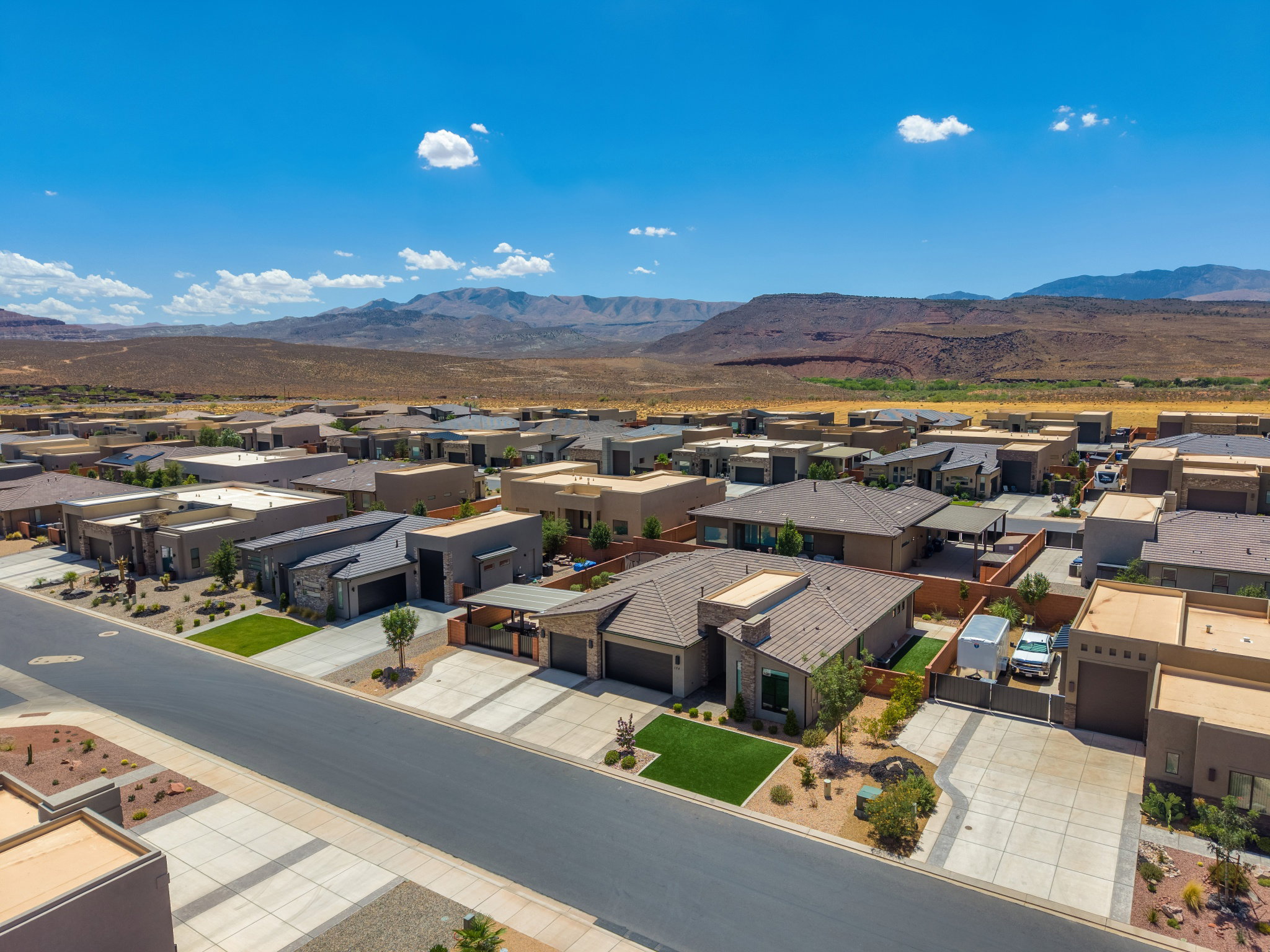 Newly constructed residential development featuring contemporary architecture and a uniform streetscape