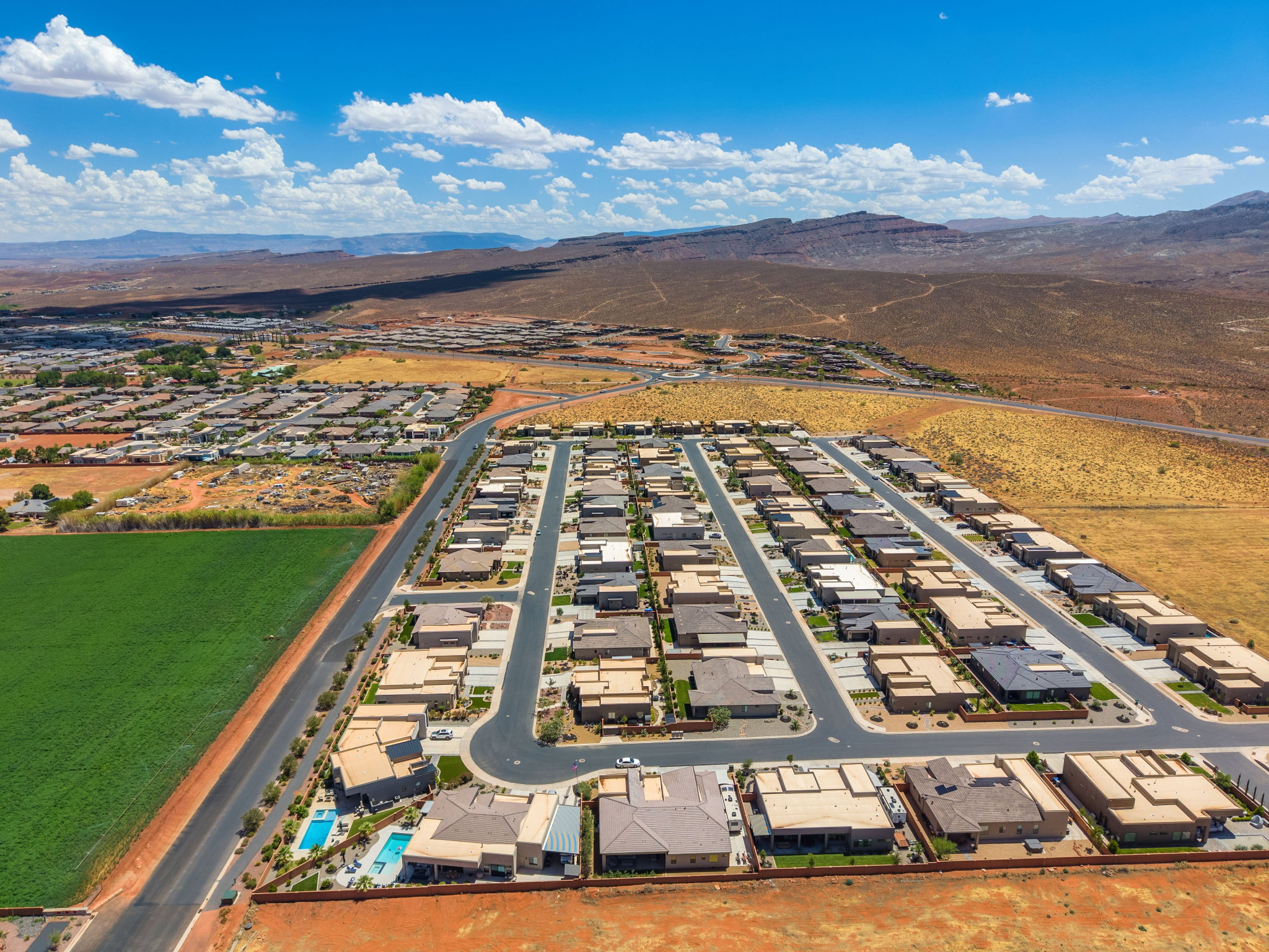 Aerial perspective showcasing a developed residential community with numerous single-story homes