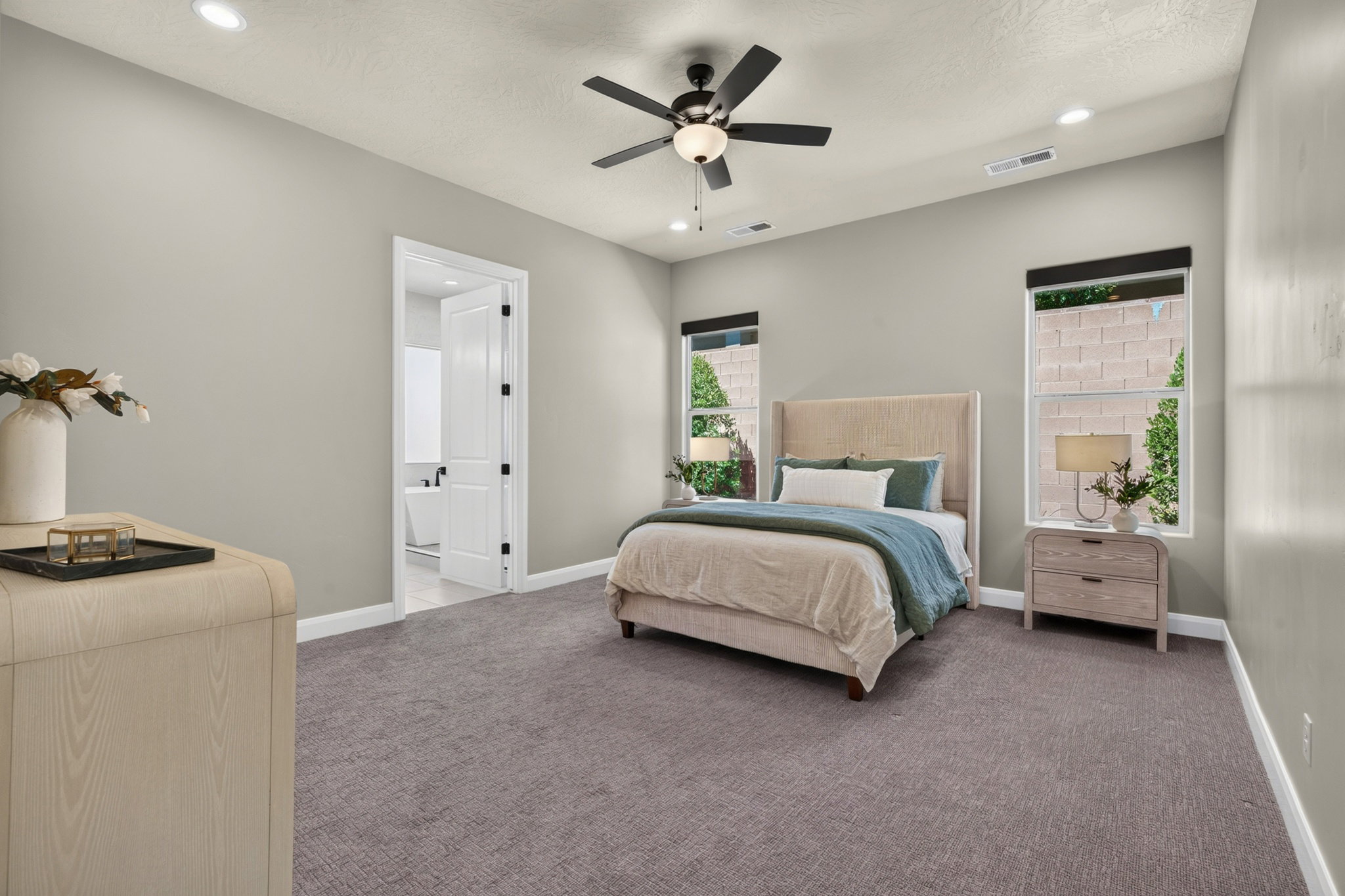 Carpeted room with recessed lighting and a ceiling fan