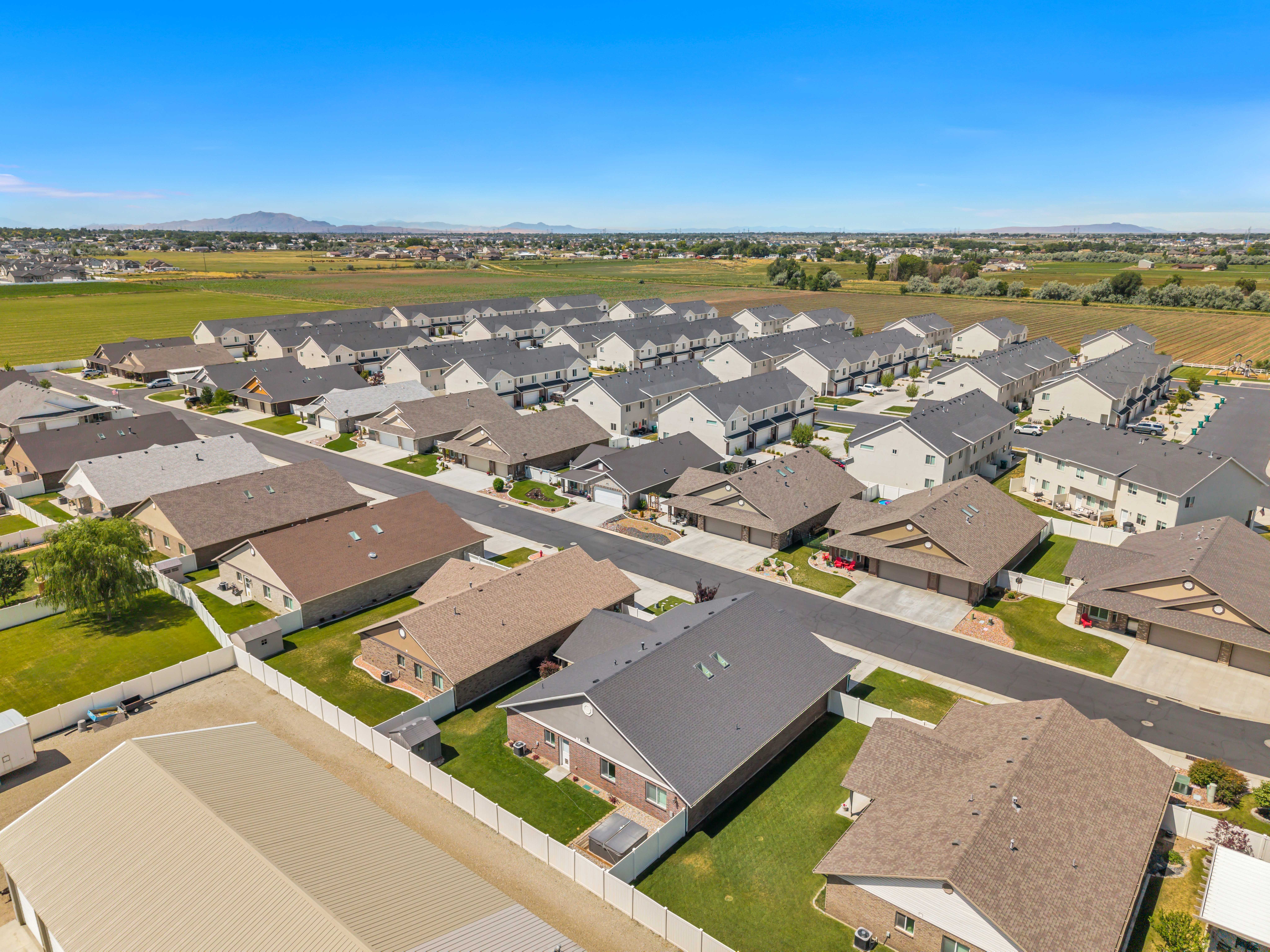 Aerial perspective of a developed residential community featuring a variety of single-story and two-story homes
