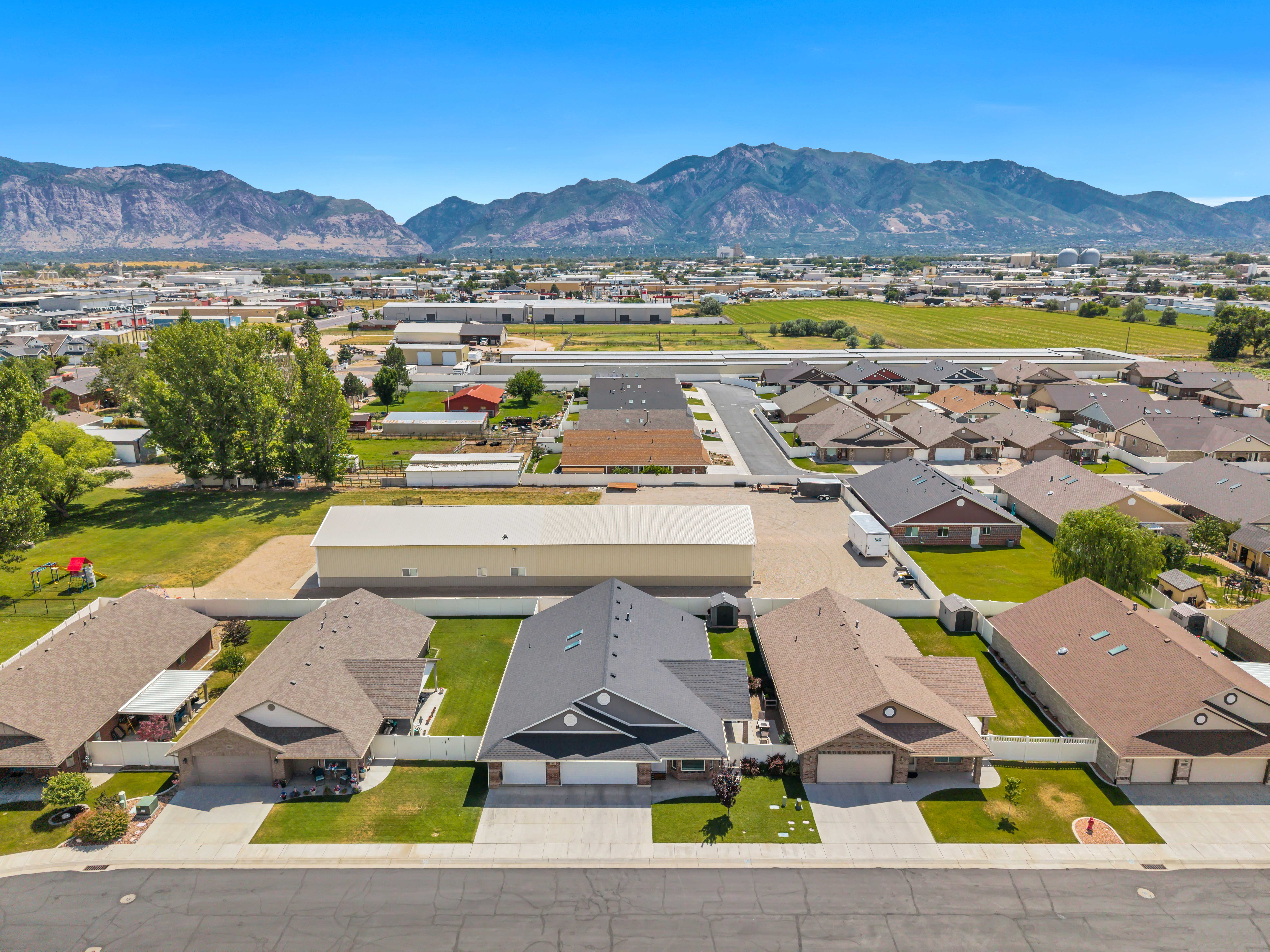 Aerial perspective of a residential neighborhood with distant mountains
