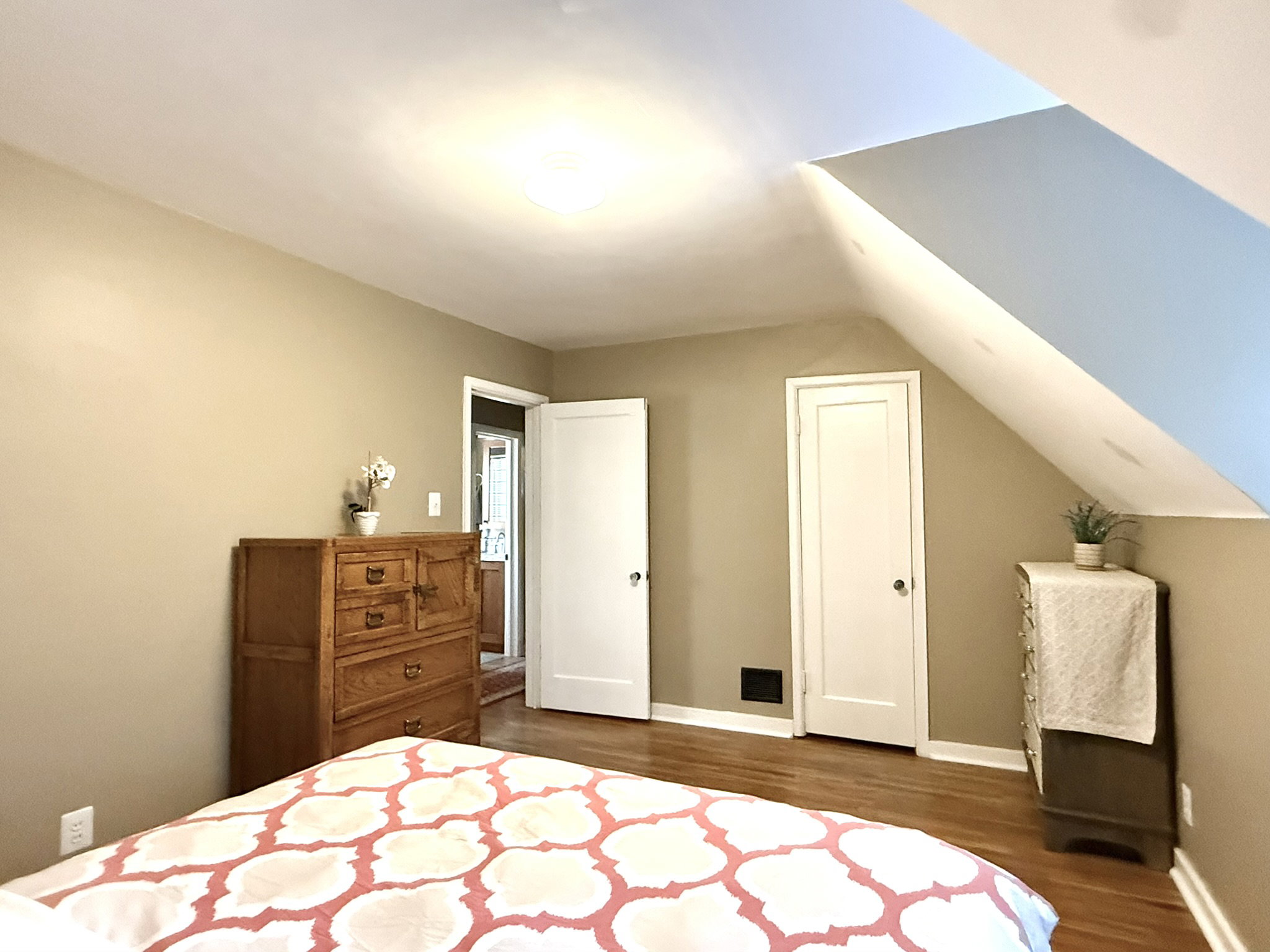 Bedroom #2 featuring hardwood flooring and a neutral wall color