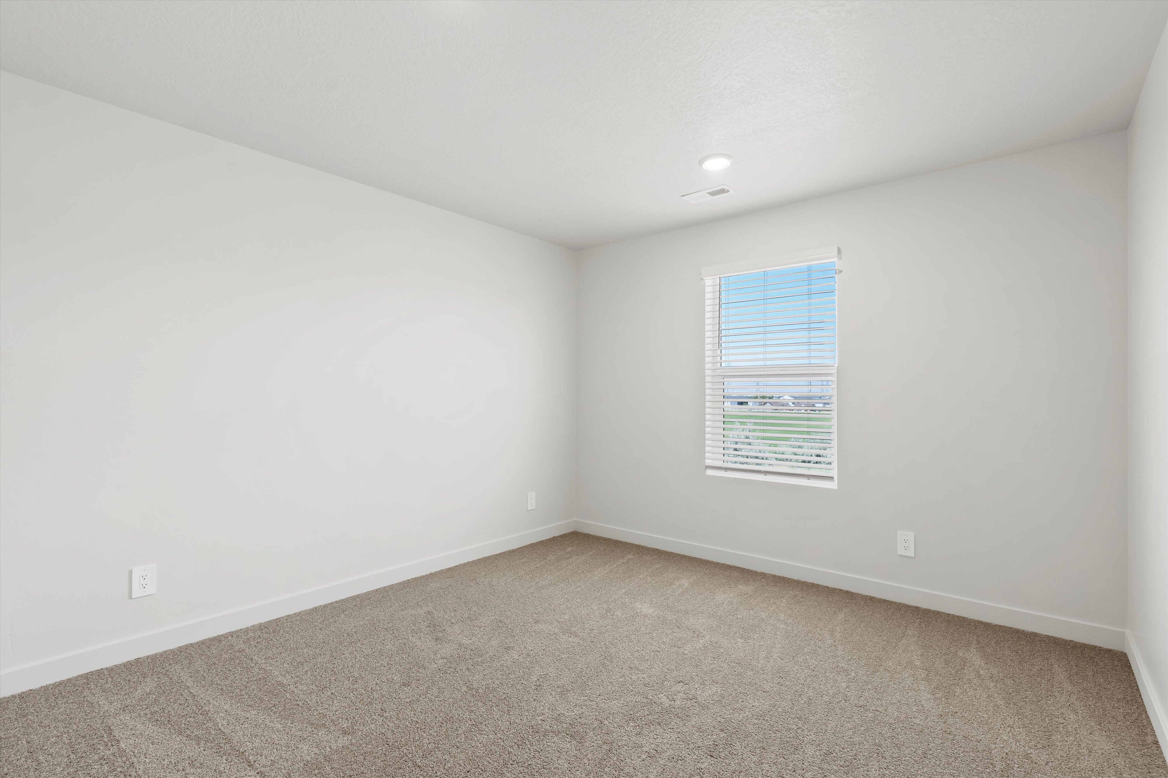 **DISCLAIMER** Interior package may vary. Carpeted room featuring a single window with horizontal blinds, white baseboards, and a recessed ceiling light