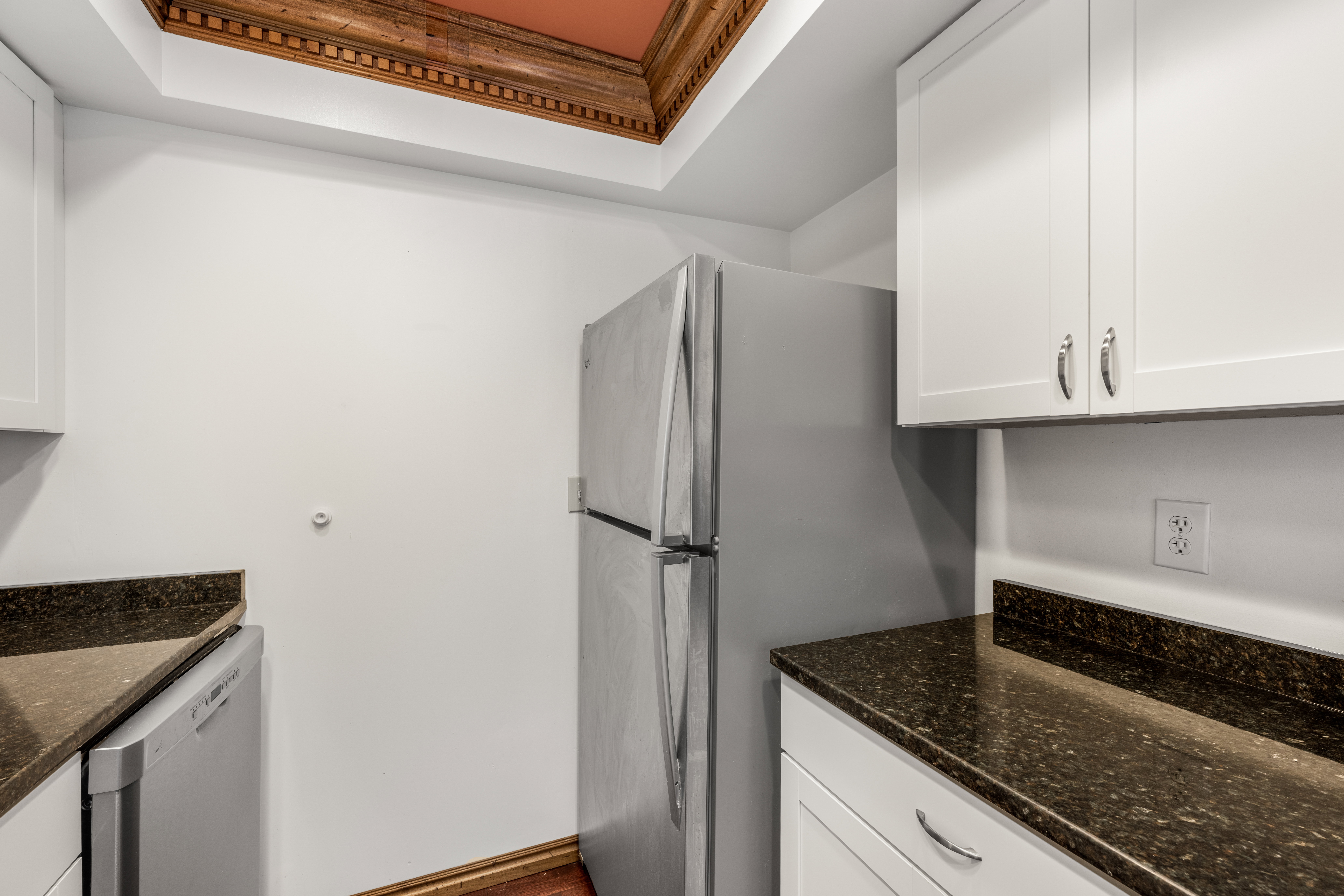 Kitchen featuring stainless steel refrigerator and dishwasher