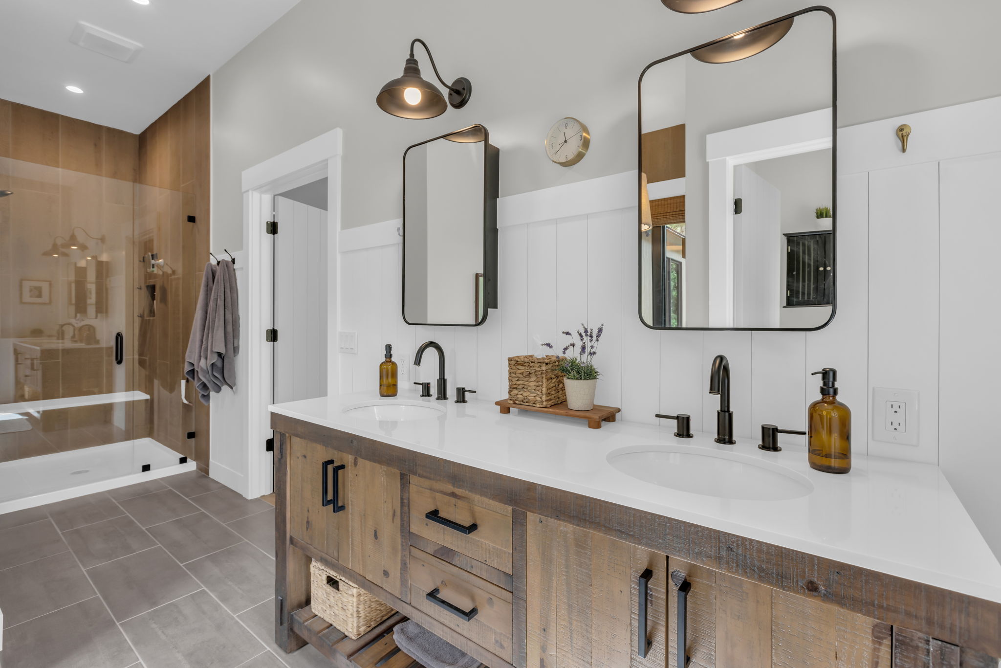 Double vanity with a white countertop and matte black fixtures