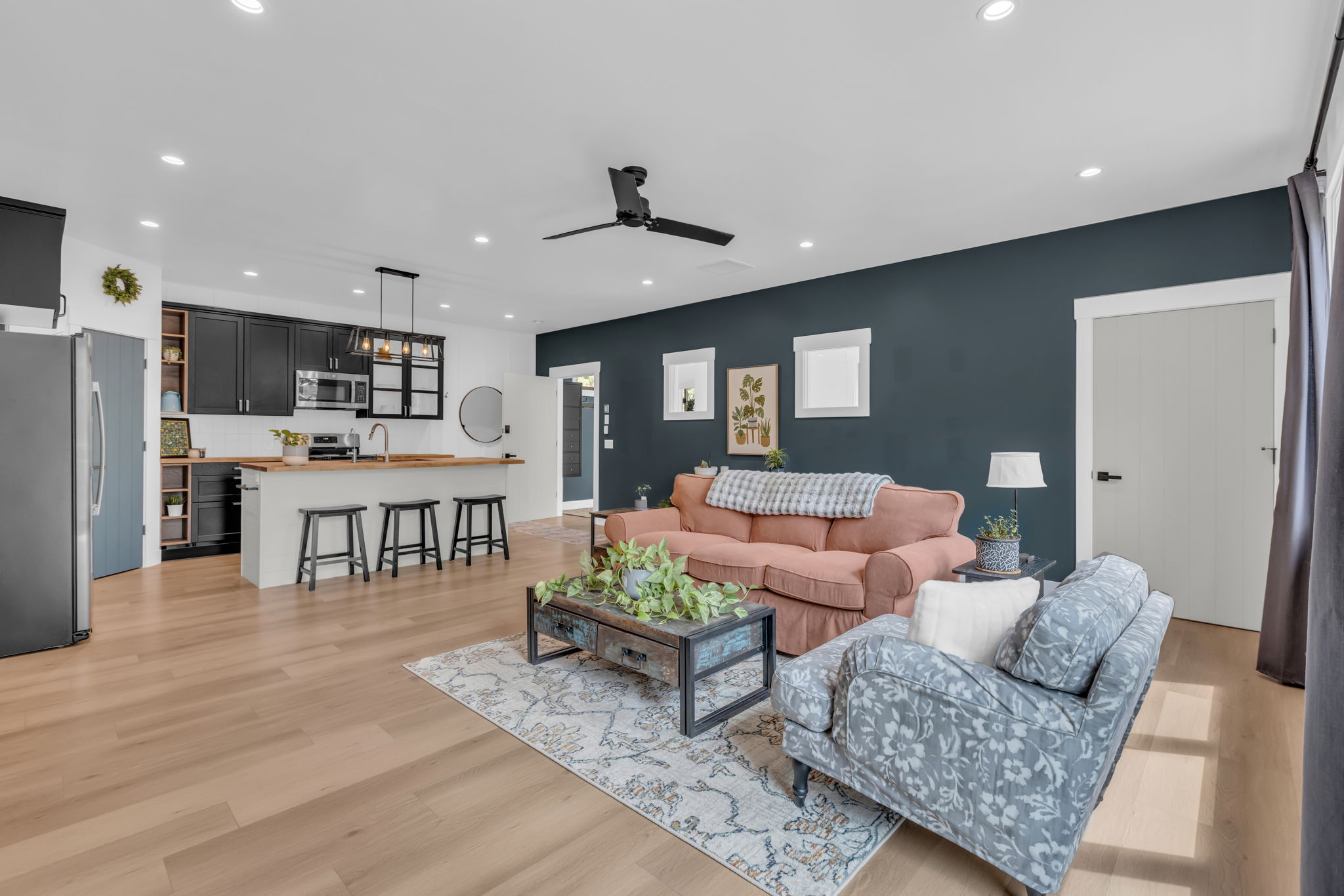 Open-concept living area featuring light wood-finish flooring throughout