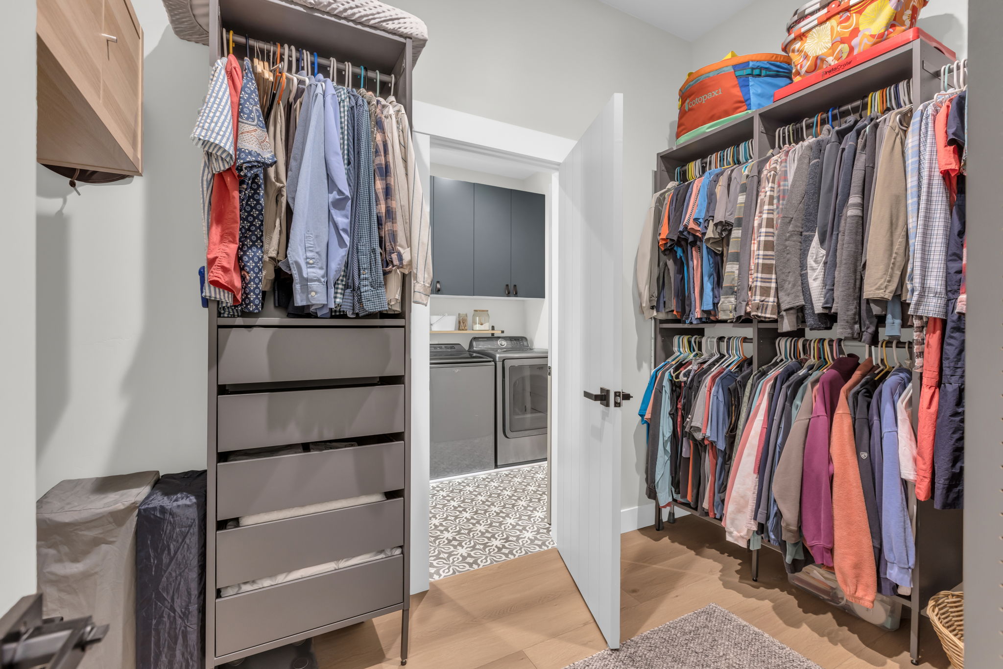 Walk-in closet with integrated shelving and drawer storage