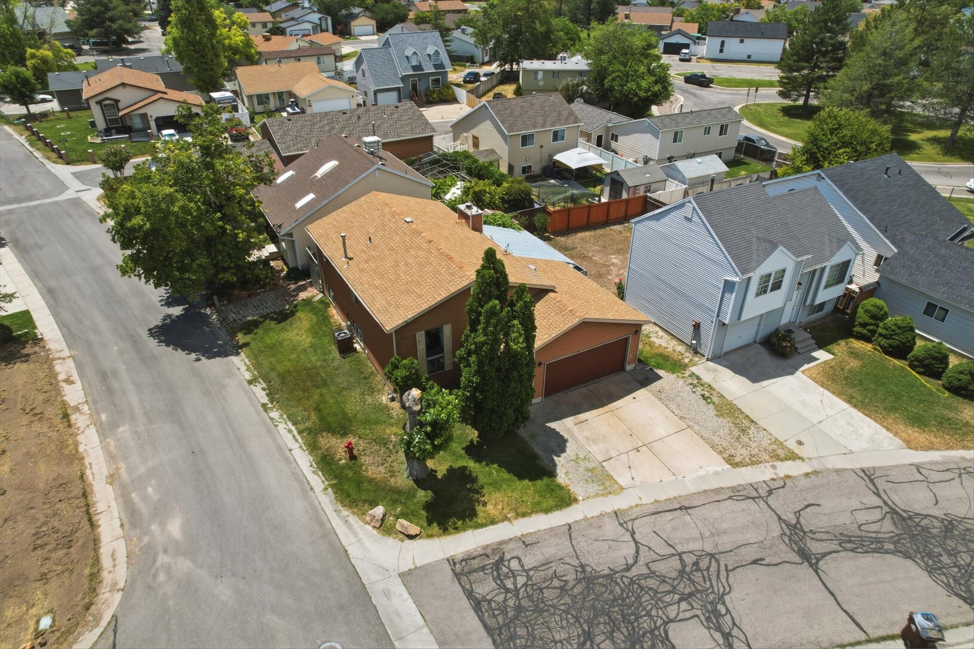 Aerial perspective showcasing a residential street with multiple properties