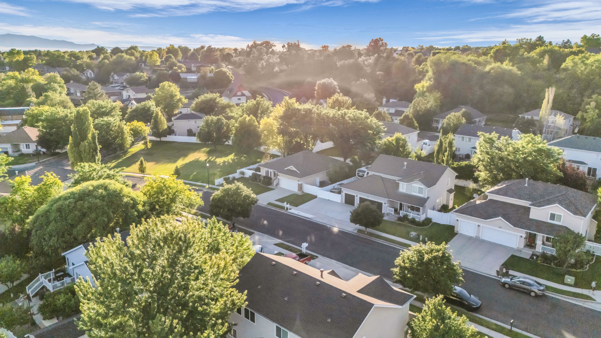 Aerial perspective showcasing a residential street with multiple properties