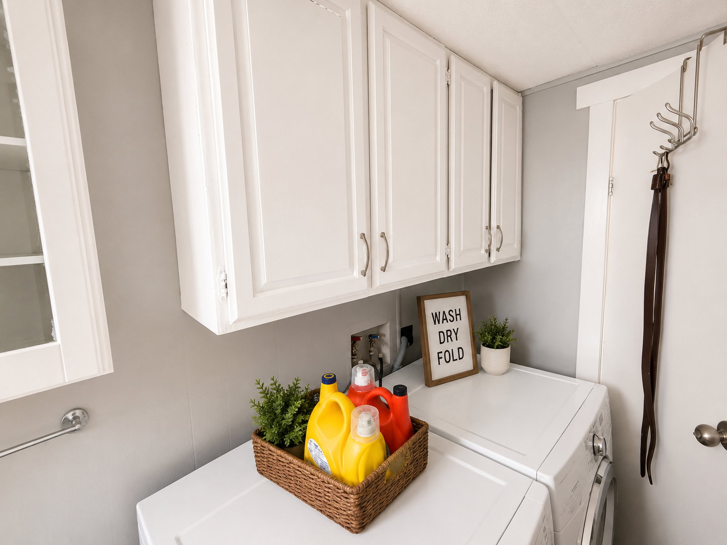 White upper cabinetry with brushed nickel hardware