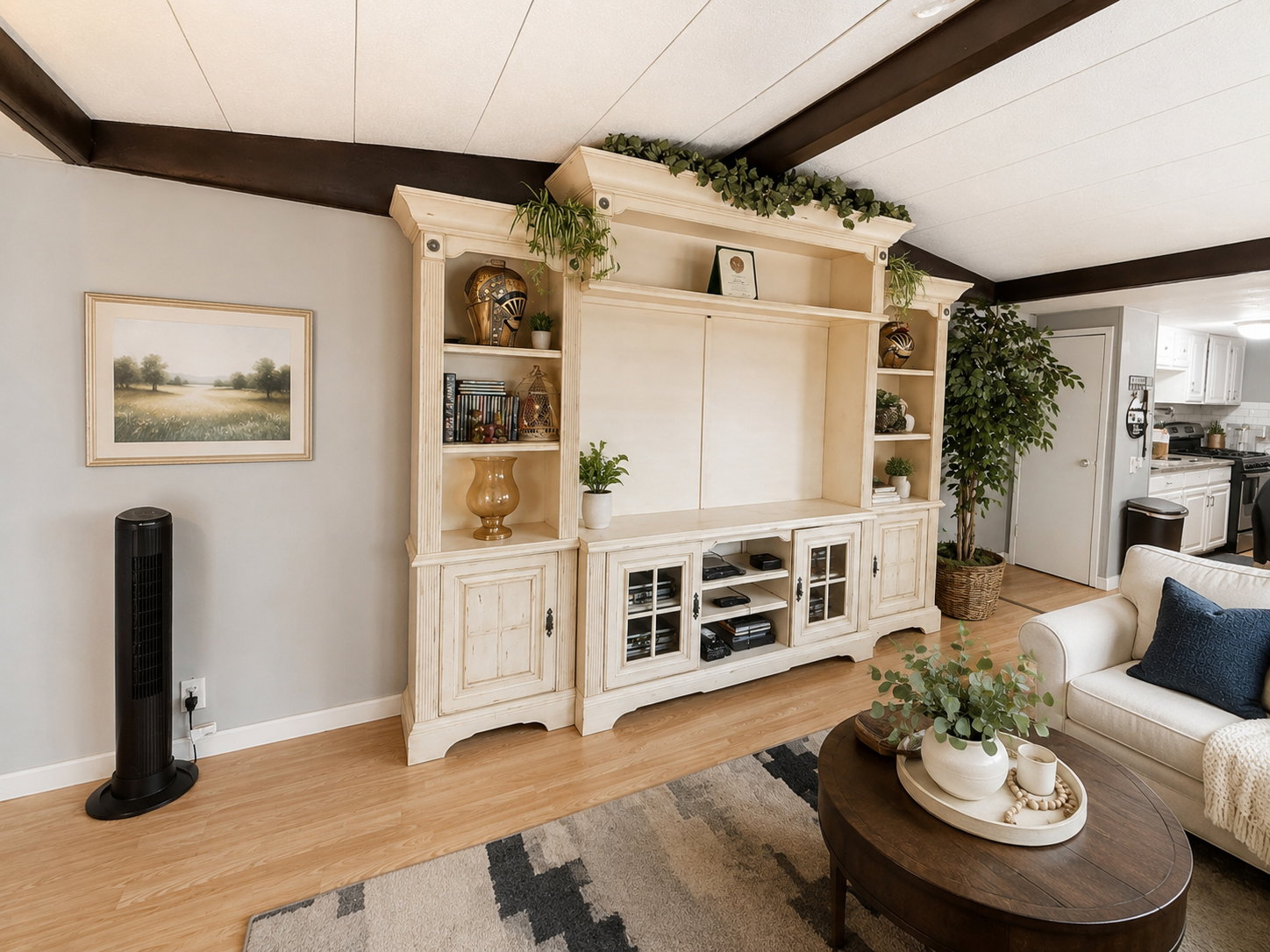 Built-in entertainment center featuring distressed wood-finish cabinetry and shelving