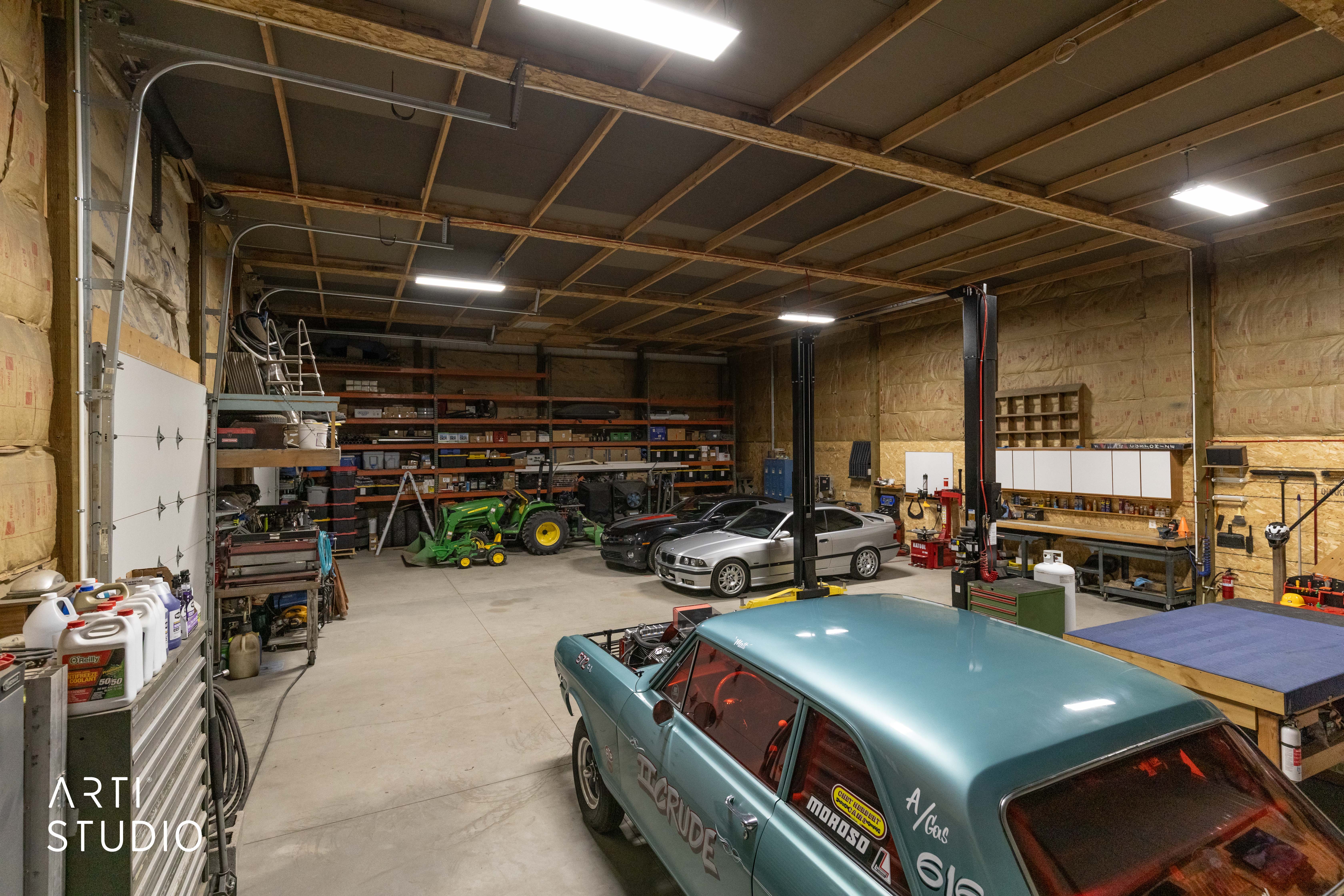 Spacious garage with high ceilings and exposed wood beams