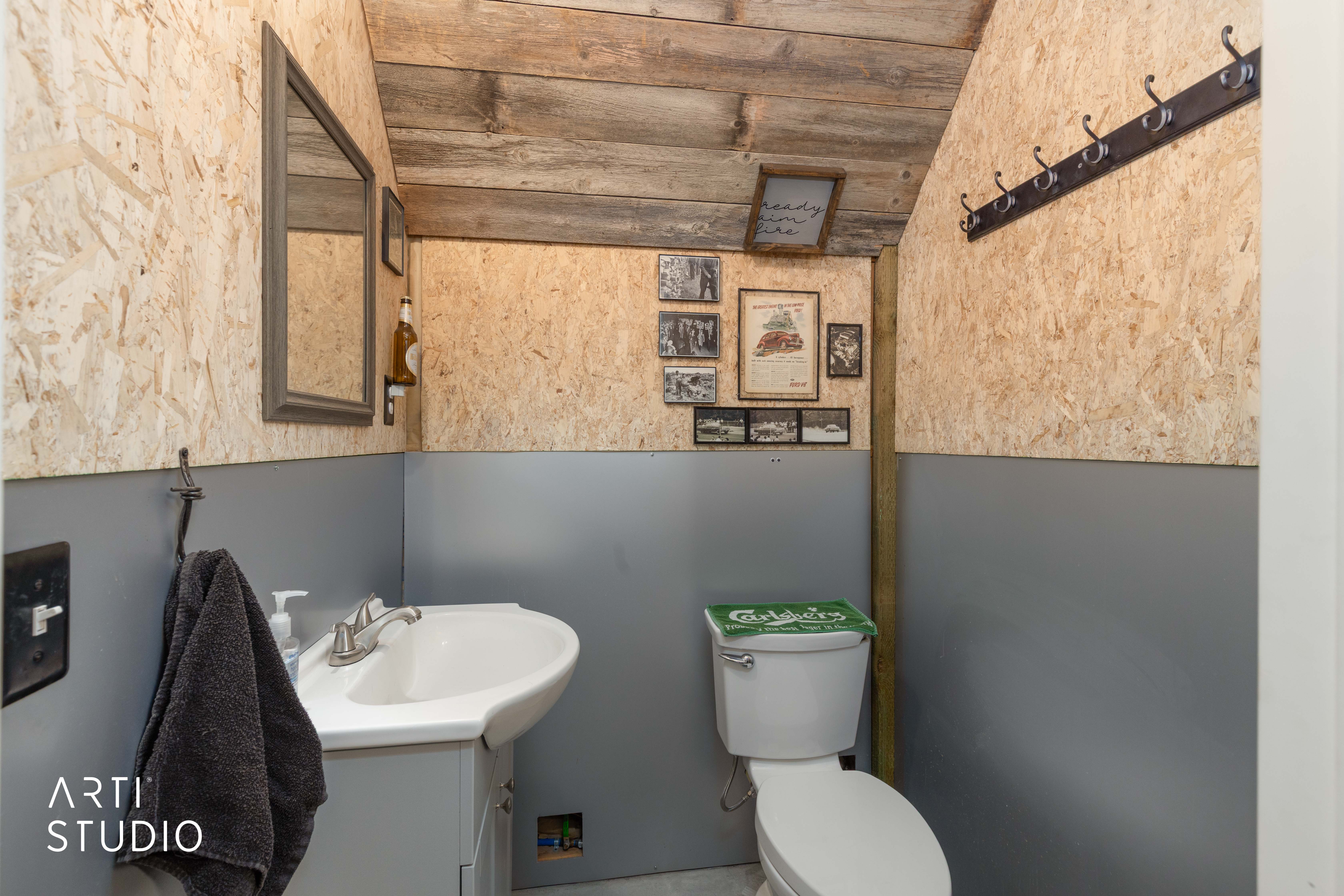 Functional washroom with a pedestal sink and coordinating vanity