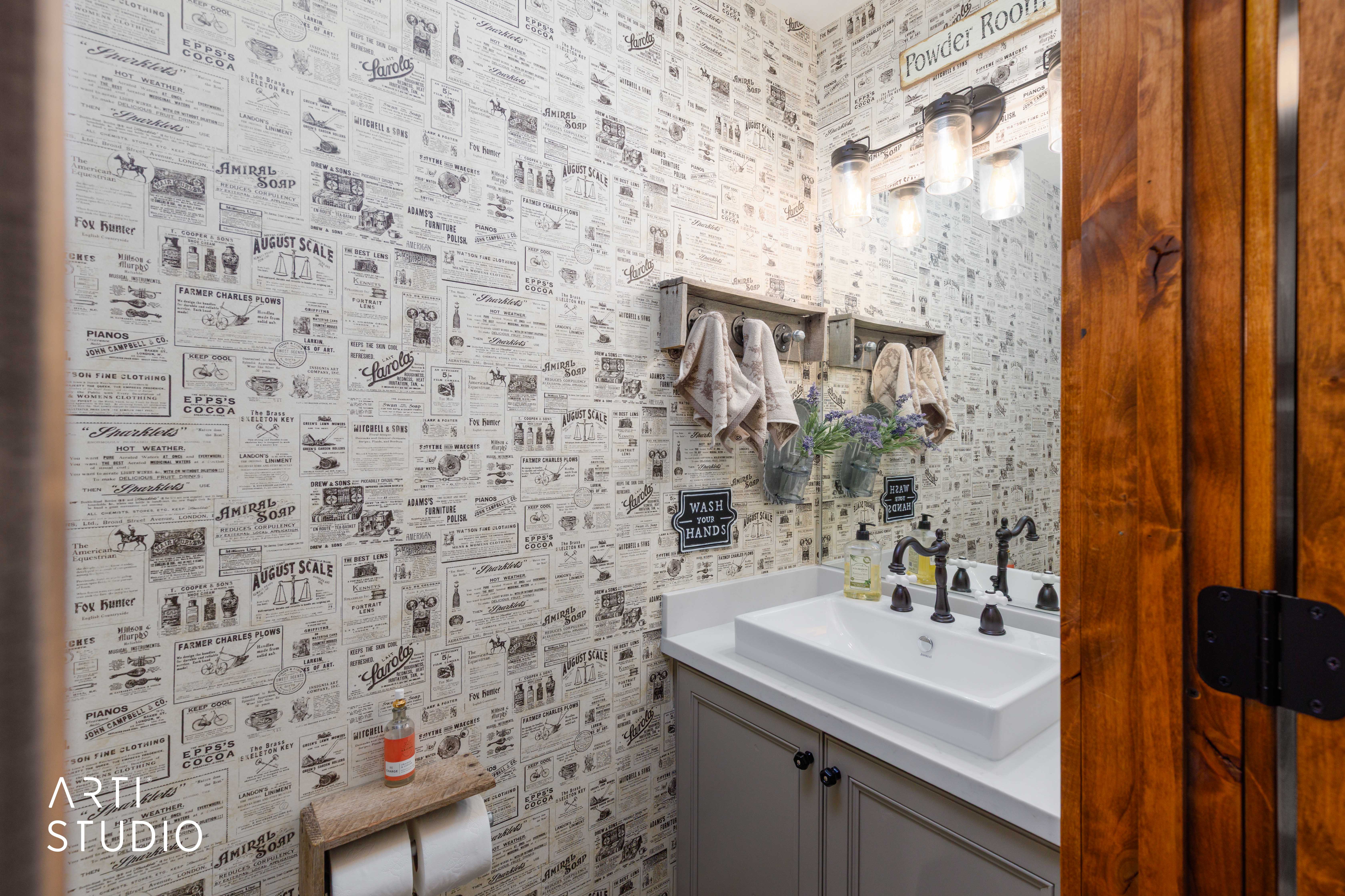 Vanity with a rectangular vessel sink, dark bronze-finish fixtures, and a light-toned countertop